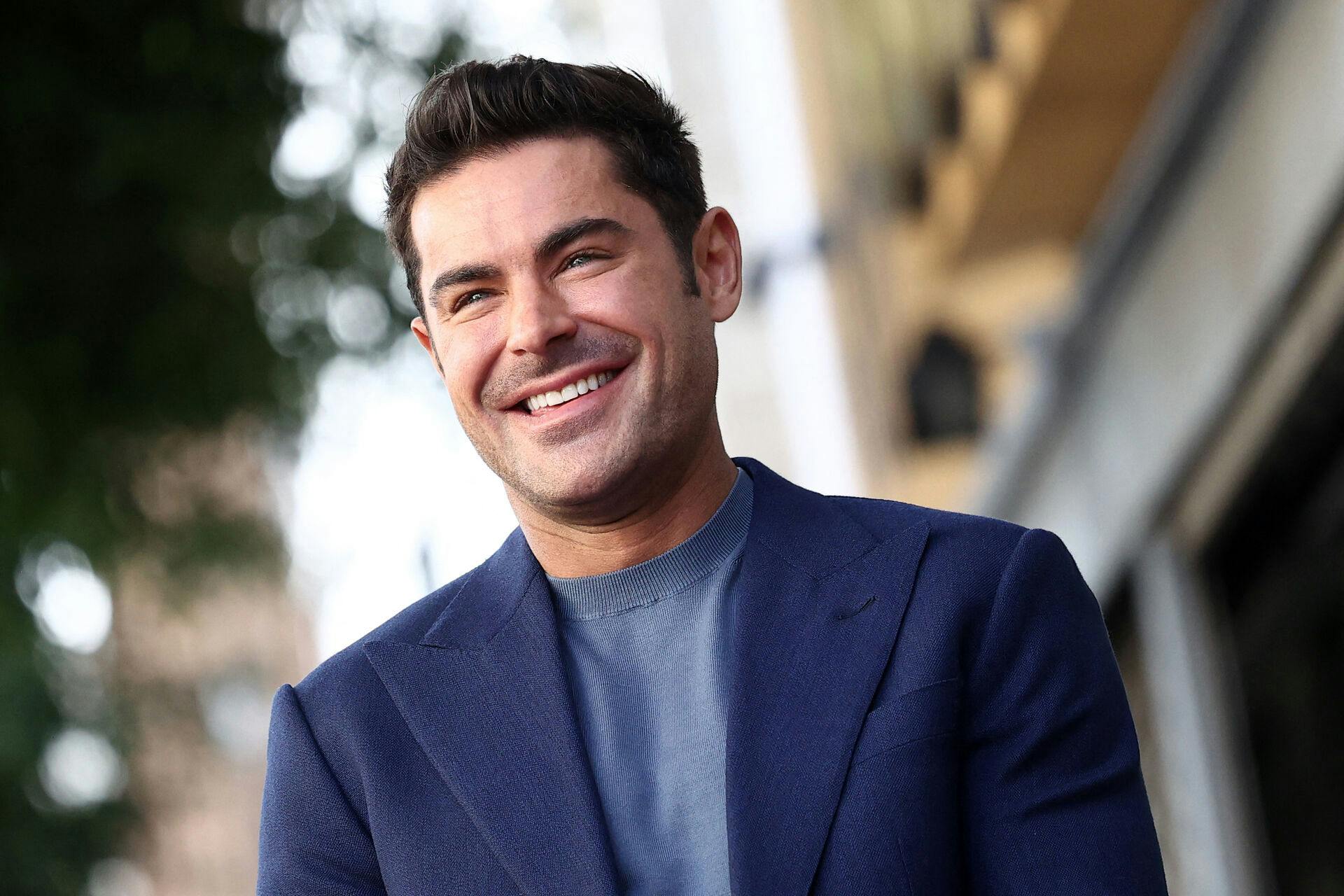 US actor Zac Efron poses attends his Hollywood Walk of Fame ceremony in Hollywood, California, December 11, 2023. (Photo by TOMMASO BODDI / AFP)
