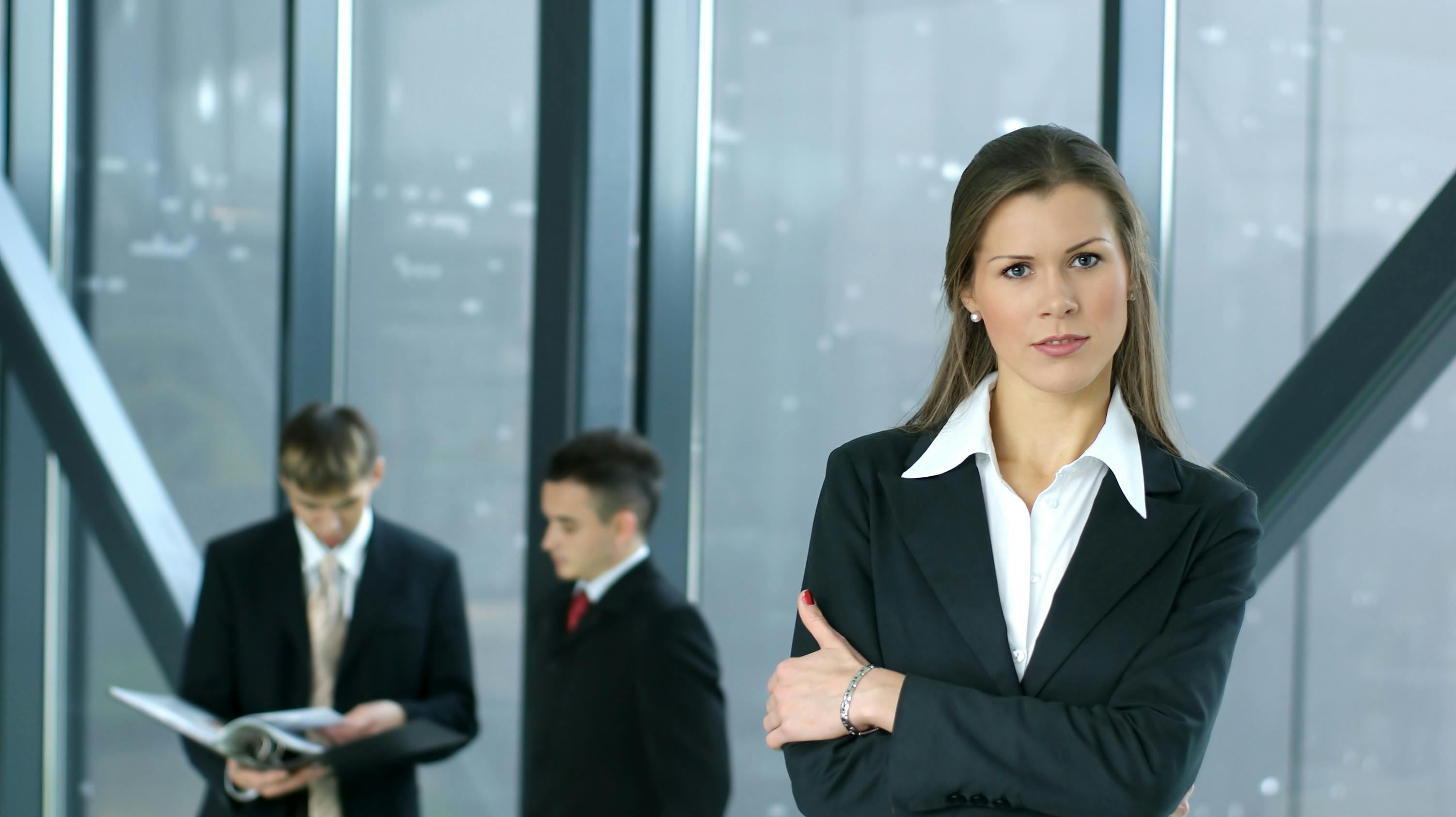 Portrait of business team over modern background