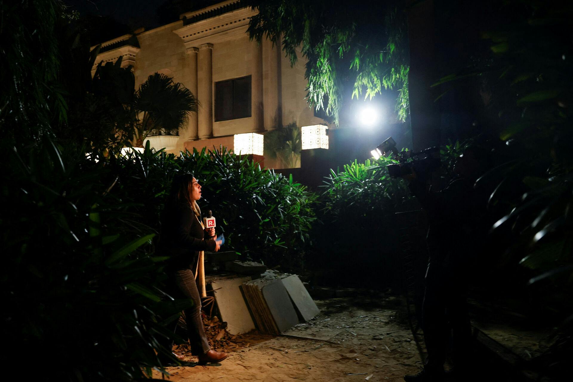 A reporter works outside the Israeli embassy, following a reported explosion nearby, in New Delhi, India, December 26, 2023. REUTERS/Anushree Fadnavis