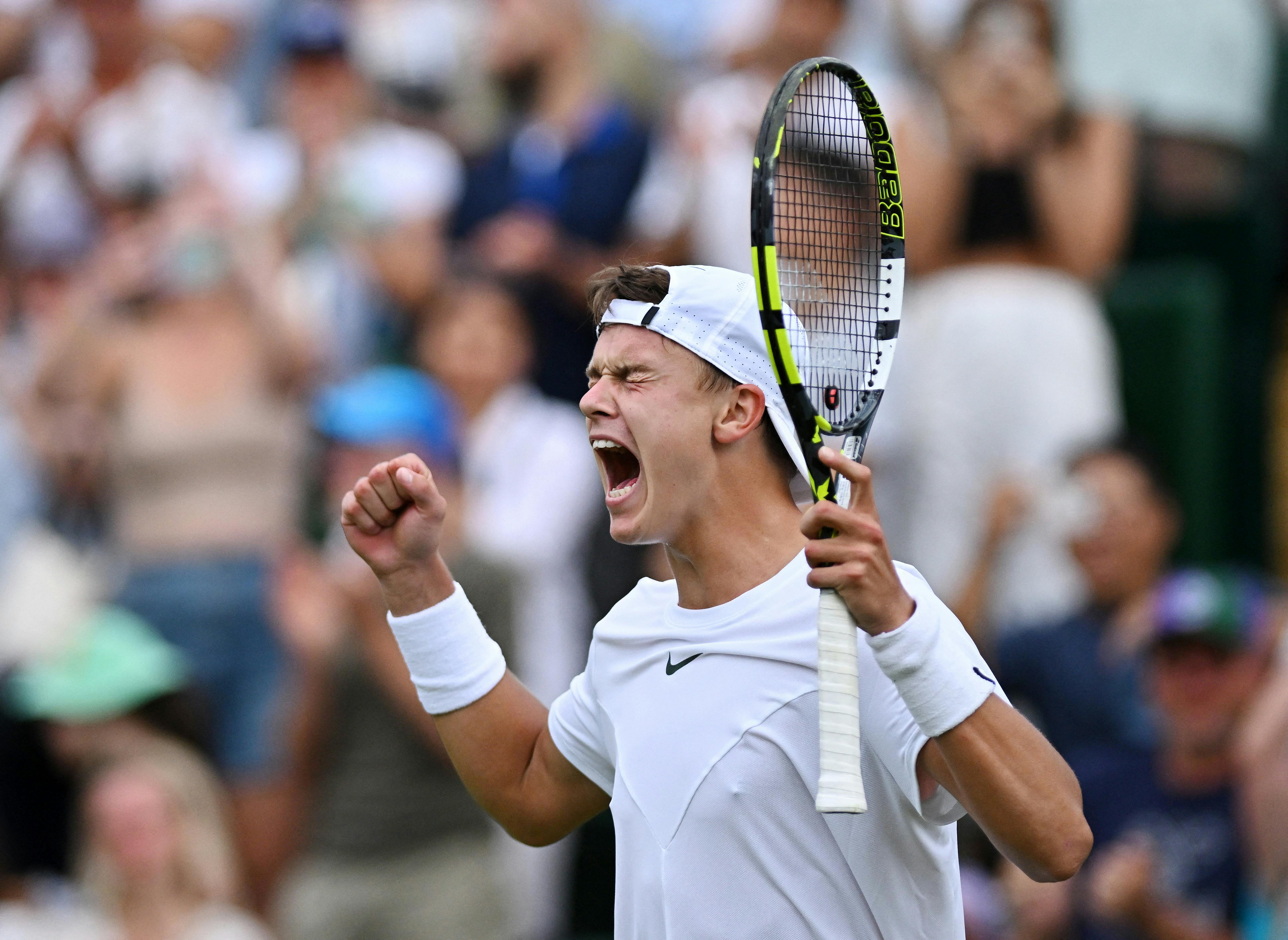 Tennis - Wimbledon - All England Lawn Tennis and Croquet Club, London, Britain - July 8, 2023 Denmark's Holger Rune celebrates winning his third round match against Spain's Alejandro Davidovich Fokina REUTERS/Dylan Martinez TPX IMAGES OF THE DAY