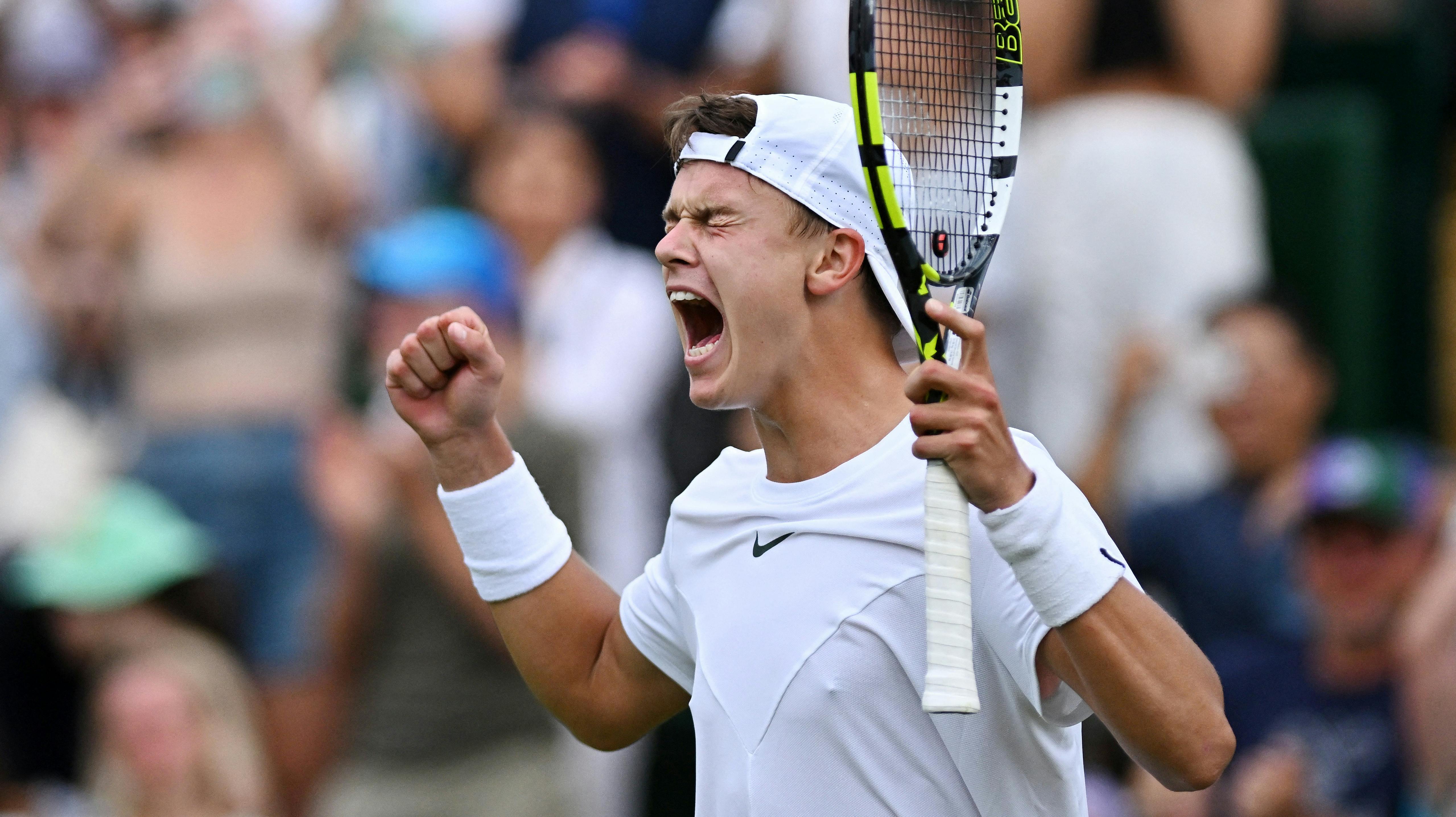 Tennis - Wimbledon - All England Lawn Tennis and Croquet Club, London, Britain - July 8, 2023 Denmark's Holger Rune celebrates winning his third round match against Spain's Alejandro Davidovich Fokina REUTERS/Dylan Martinez TPX IMAGES OF THE DAY