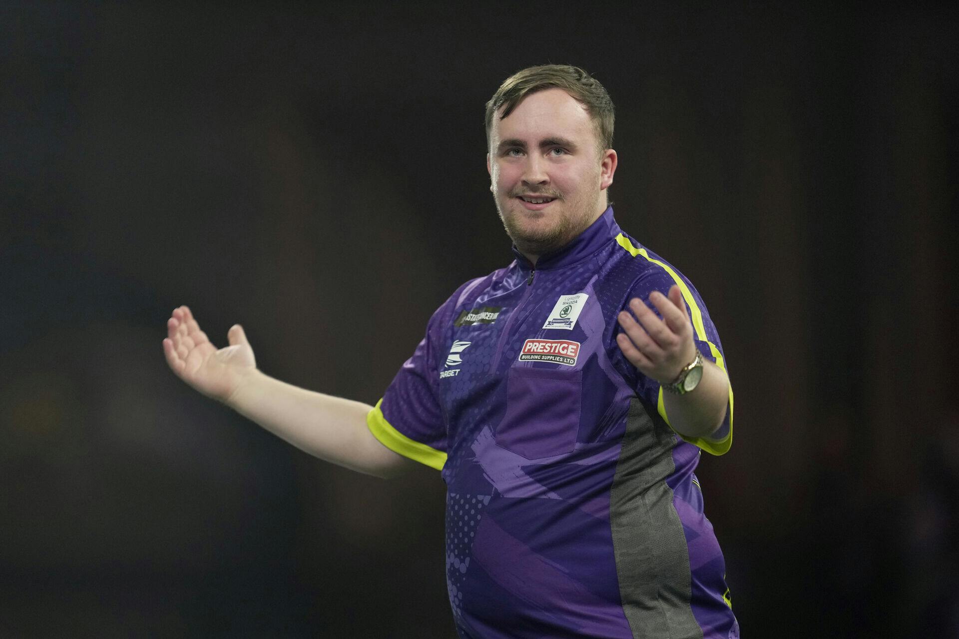 Luke Littler of England reacts during the semifinal match against Scott Williams of England at the World Darts Championship, in London, Tuesday, Jan. 2, 2024. (AP Photo/Kin Cheung)