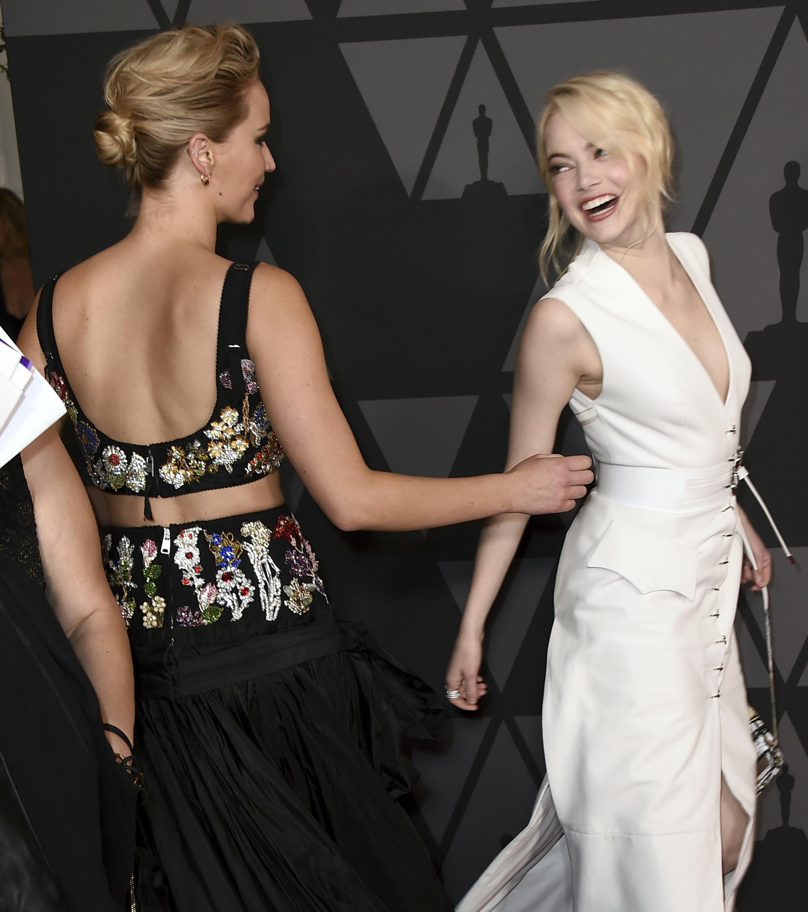 Emma Stone, right, and Jennifer Lawrence arrive at the 9th annual Governors Awards at the Dolby Ballroom on Saturday, Nov. 11, 2017, in Los Angeles. (Photo by Jordan Strauss/Invision/AP)