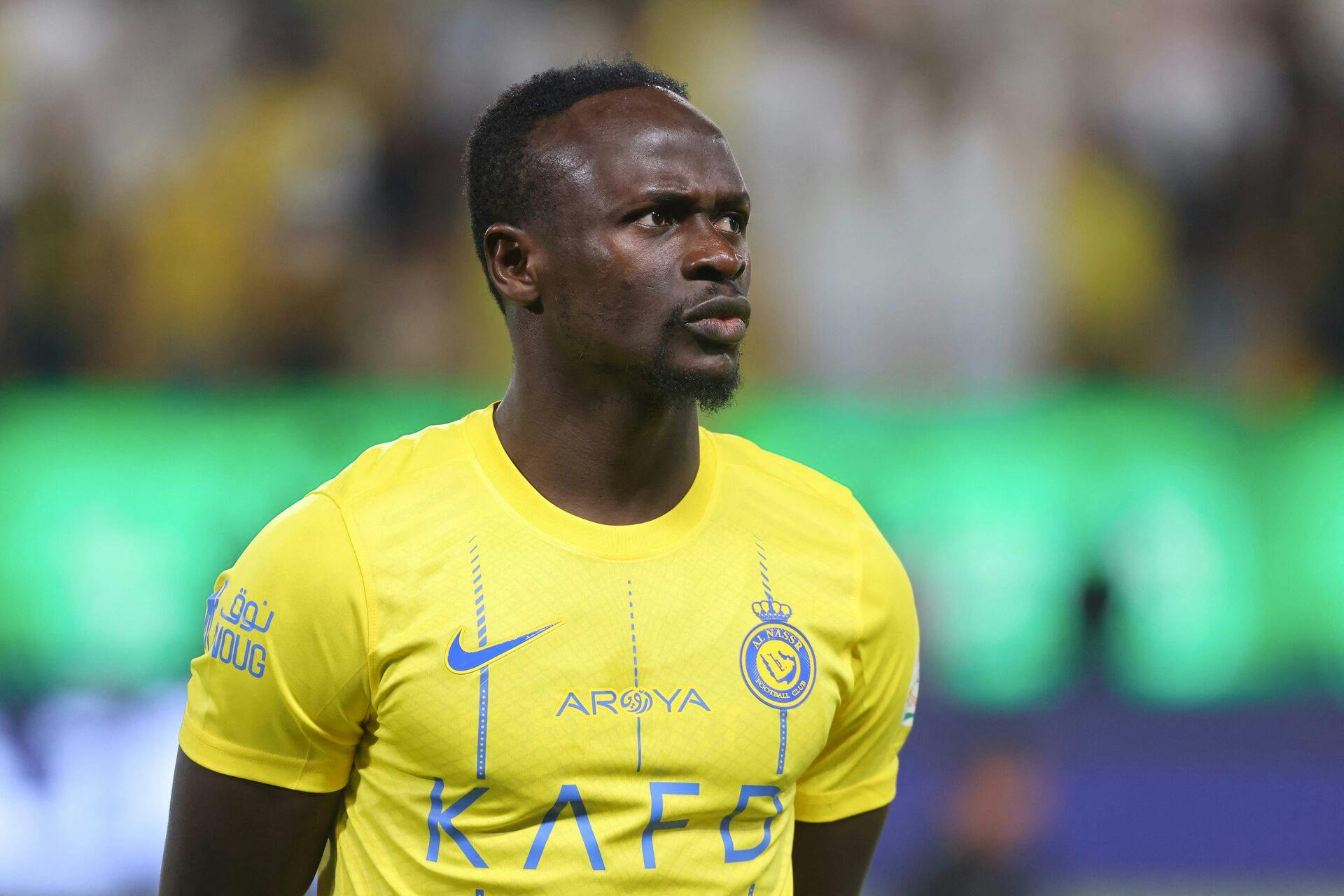 Nassr's Senegalese Forward #10 Sadio Mane stands in line for the national anthems ahead of the Saudi Pro League football match between Al-Nassr and Abha at the King Saud University Stadium in Riyadh on October 6, 2023. (Photo by Fayez NURELDINE / AFP)
