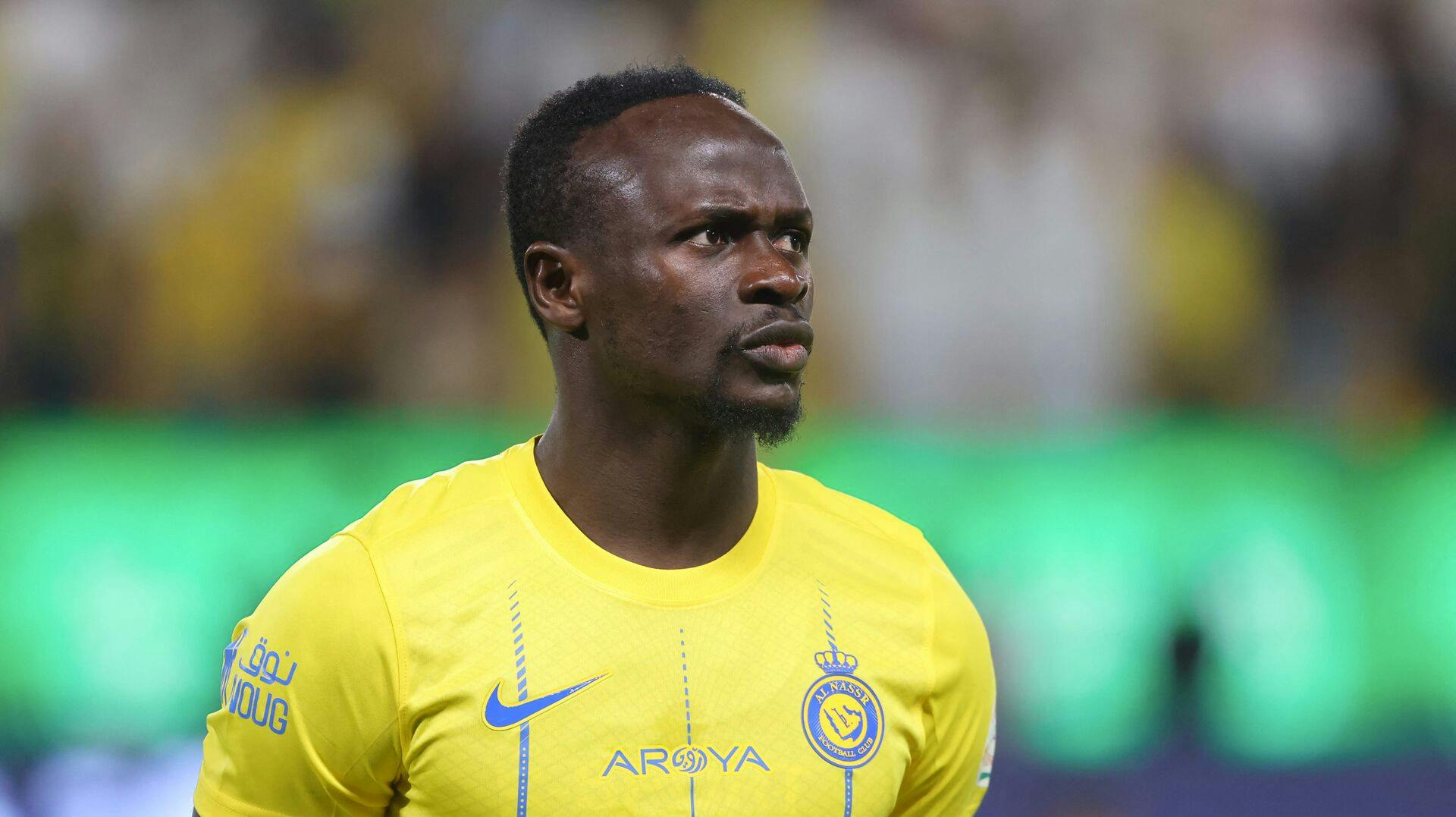 Nassr's Senegalese Forward #10 Sadio Mane stands in line for the national anthems ahead of the Saudi Pro League football match between Al-Nassr and Abha at the King Saud University Stadium in Riyadh on October 6, 2023. (Photo by Fayez NURELDINE / AFP)