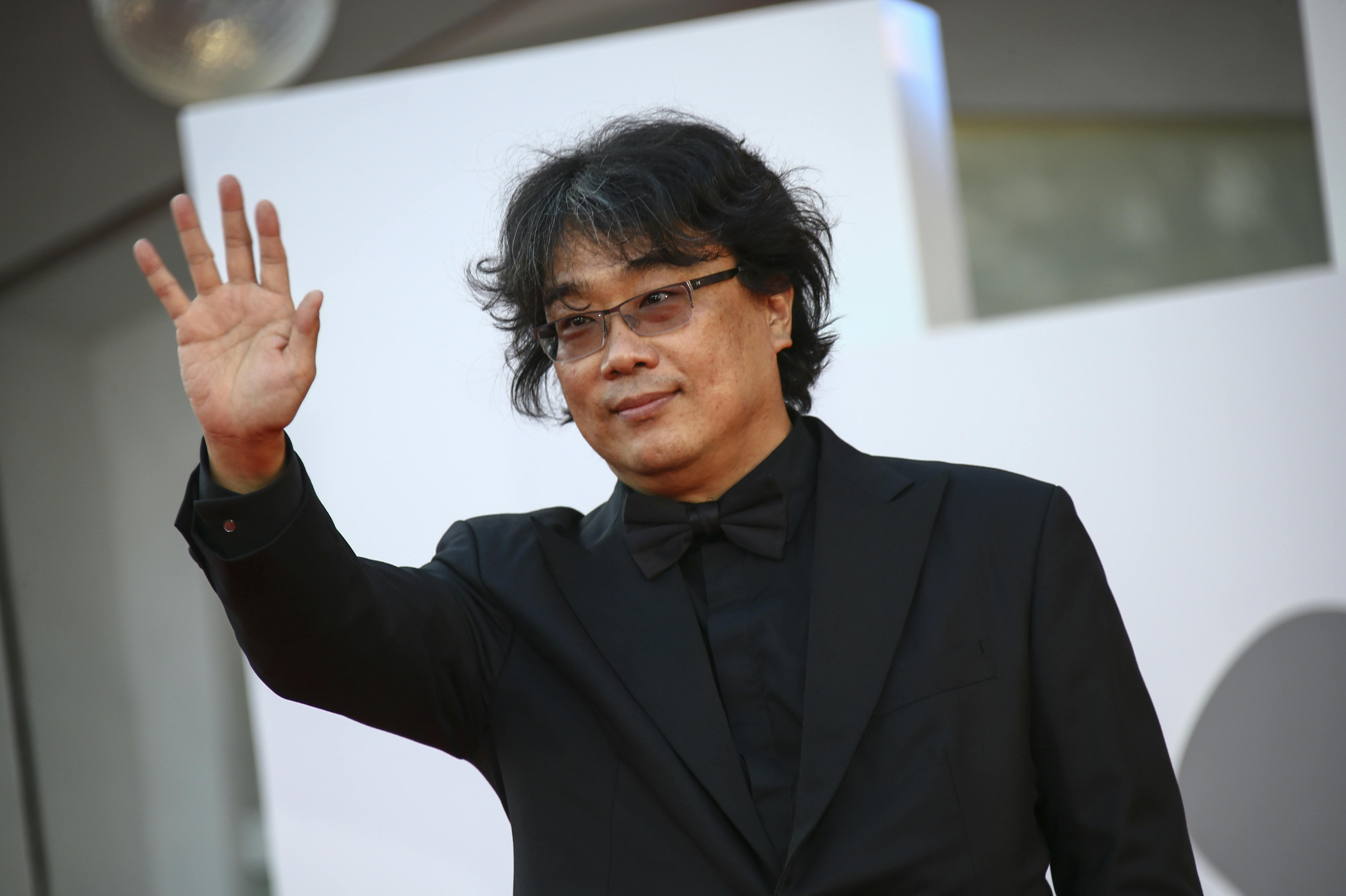 Bong Joon-ho poses for photographers upon arrival at the closing ceremony of the 78th edition of the Venice Film Festival in Venice, Italy, Saturday, Sept. 11, 2021. (Photo by Joel C Ryan/Invision/AP)