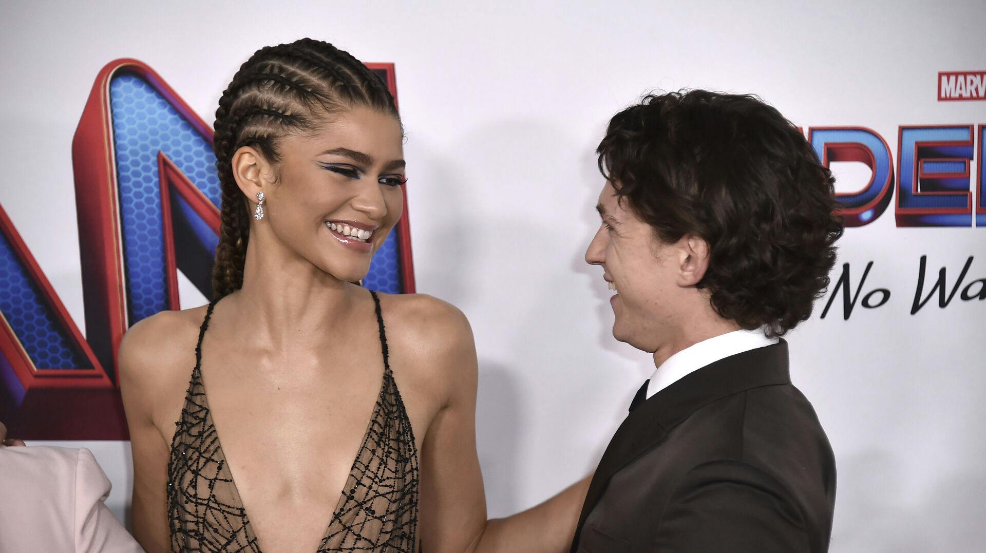 Zendaya, left, and Tom Holland arrive at the premiere of "Spider-Man: No Way Home" at the Regency Village Theater on Monday, Dec. 13, 2021, in Los Angeles. (Photo by Jordan Strauss/Invision/AP)