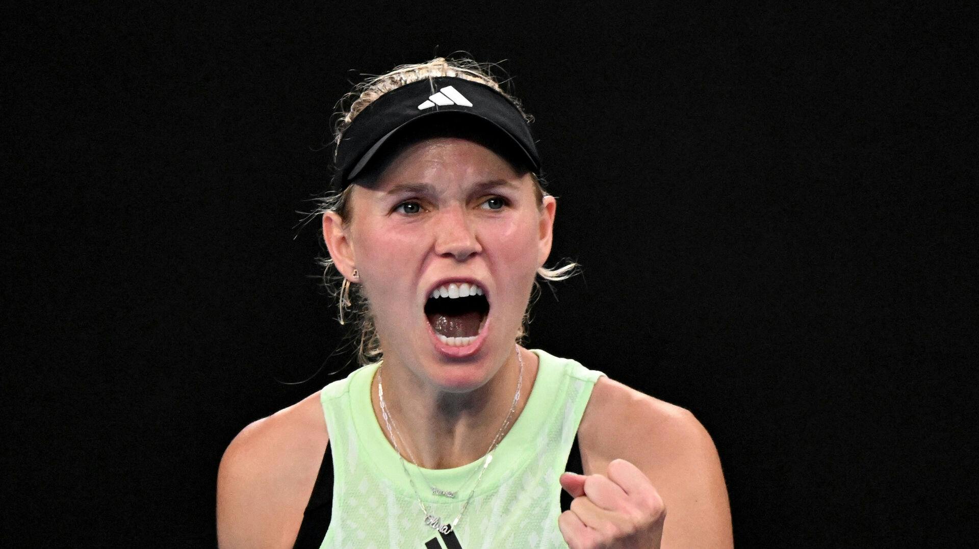 Tennis - Australian Open - Melbourne Park, Melbourne, Australia - January 14, 2024 Denmark's Caroline Wozniacki reacts during her first round match against Poland's Magda Linette REUTERS/Tracey Nearmy