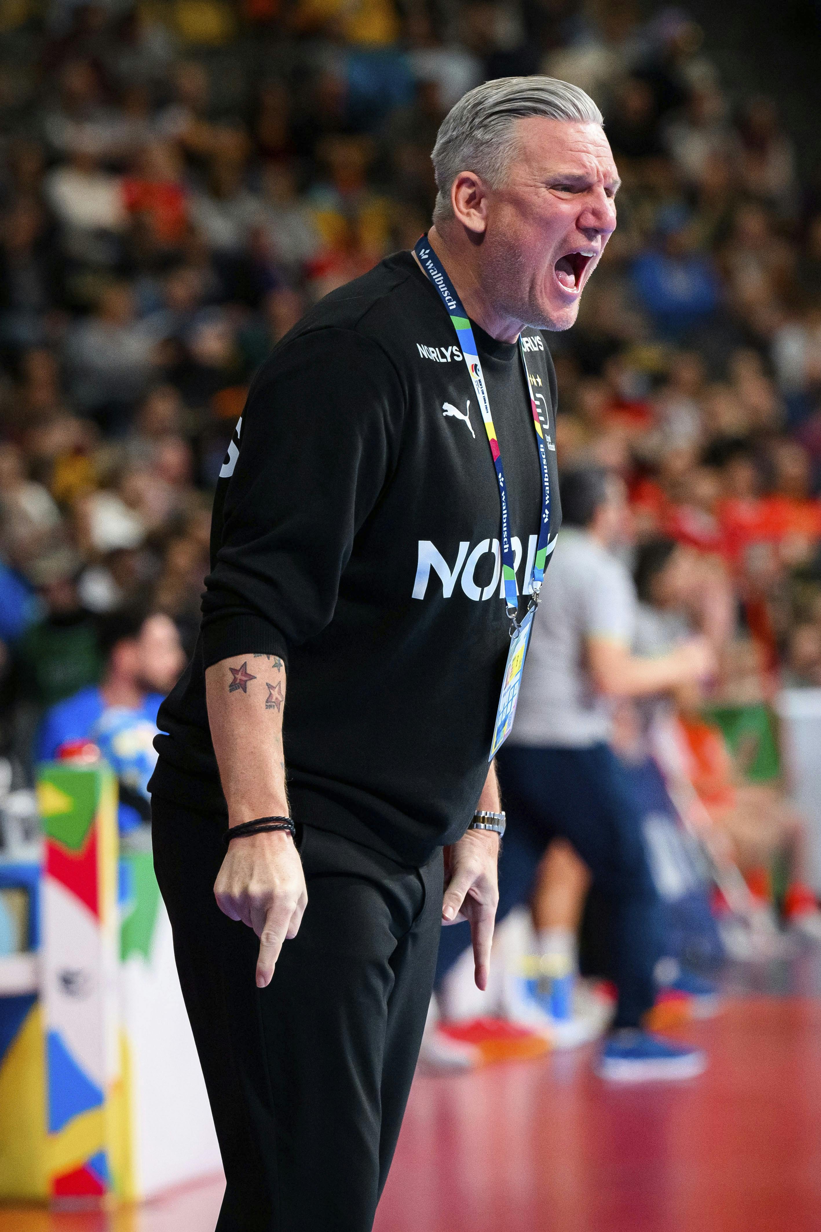 Denmark's coach Nikolaj Jacobsen gestures on the sidelines, during the European Handball Championship preliminary round, Group F match between Denmark and Greece, in Munich, Germany, Saturday, Jan. 13, 2024, (Marco Wolf/dpa via AP)