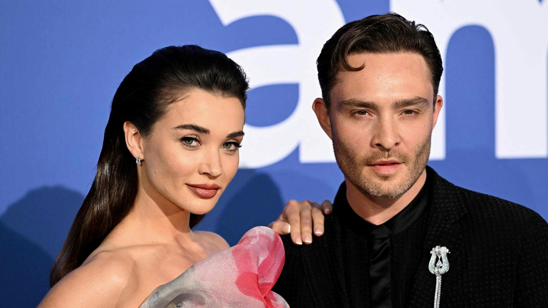British actress Amy Jackson (L) and British actor Ed Westwick arrive to attend the annual amfAR Cinema Against AIDS Cannes Gala at the Hotel du Cap-Eden-Roc in Cap dAntibes, southern France, on the sidelines of the 76th Cannes Film Festival, on May 25, 2023. (Photo by Stefano Rellandini / AFP)