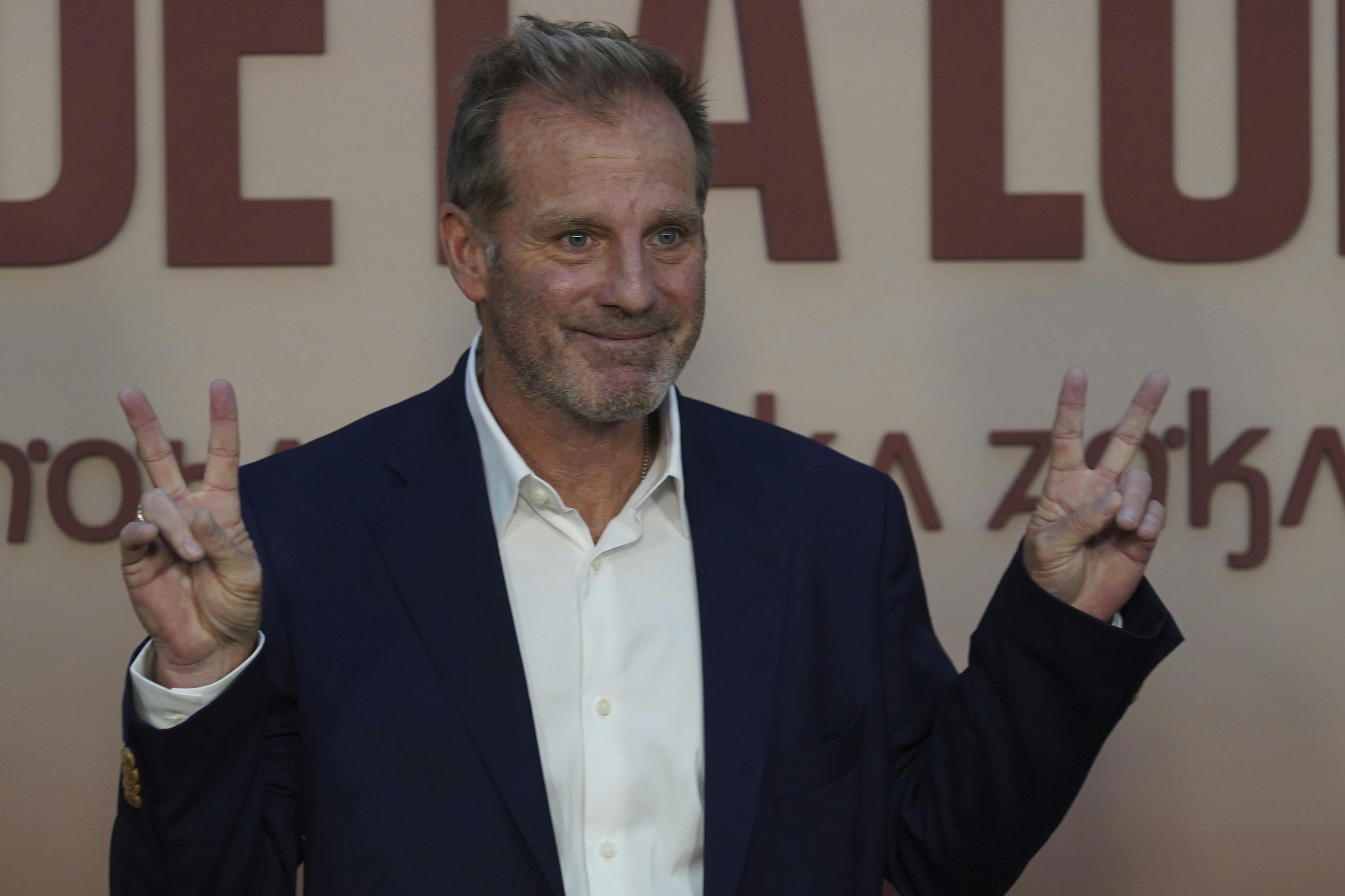 Producer Bradley Thomas gestures for the photographers upon his arrival for the premiere of the film Killers of the Flower Moon, in Mexico City, Wednesday, Oct. 11, 2023. (AP Photo/Marco Ugarte)