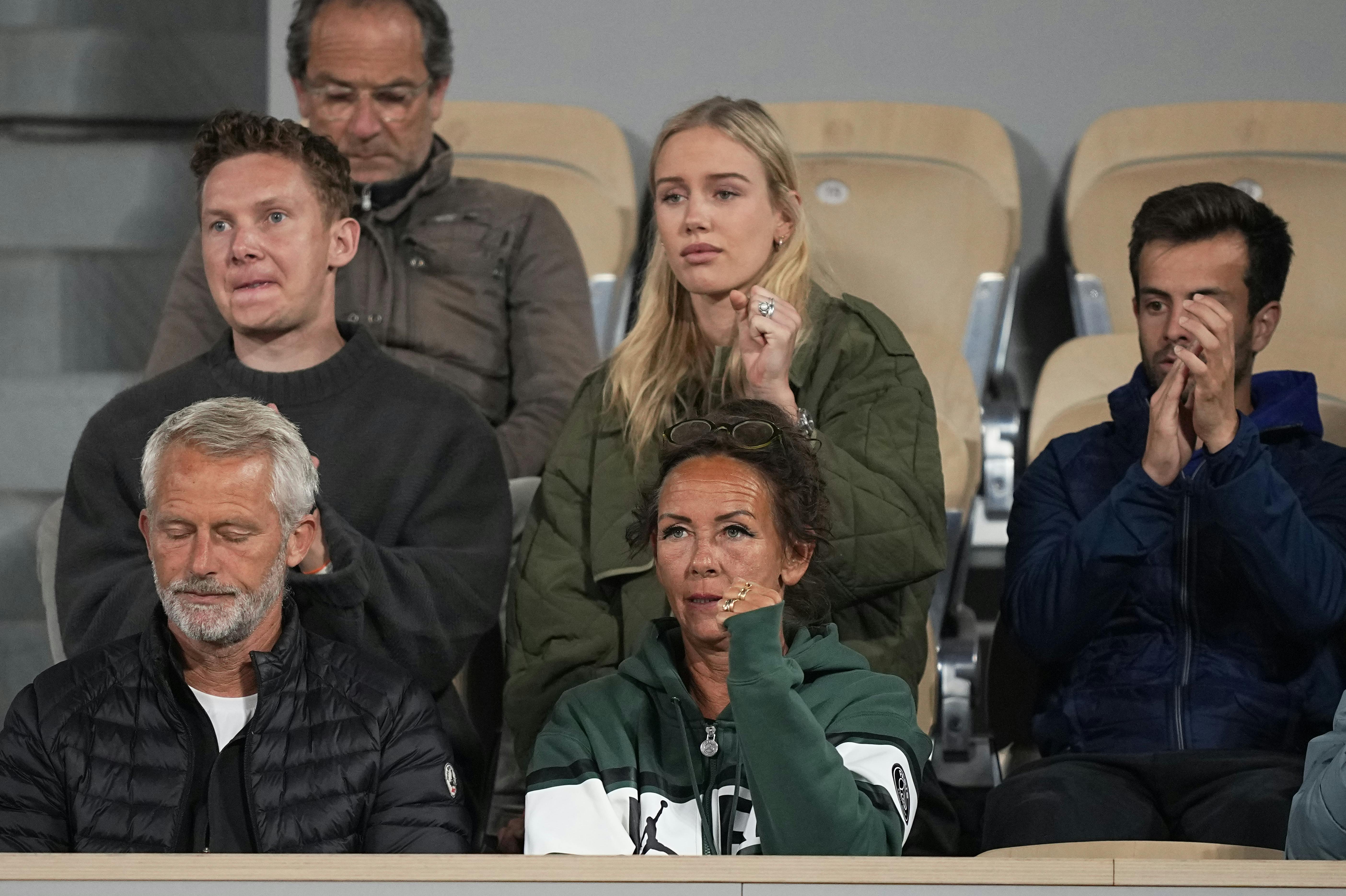 Denmark's Holger Rune's mother Aneke, bottom center, his sister Alma, top center, and coach Lars Christensen. bottom left, watch the quarterfinal match against Norway's Casper Ruud at the French Open tennis tournament in Roland Garros stadium in Paris, France, Wednesday, June 1, 2022. (AP Photo/Michel Euler)