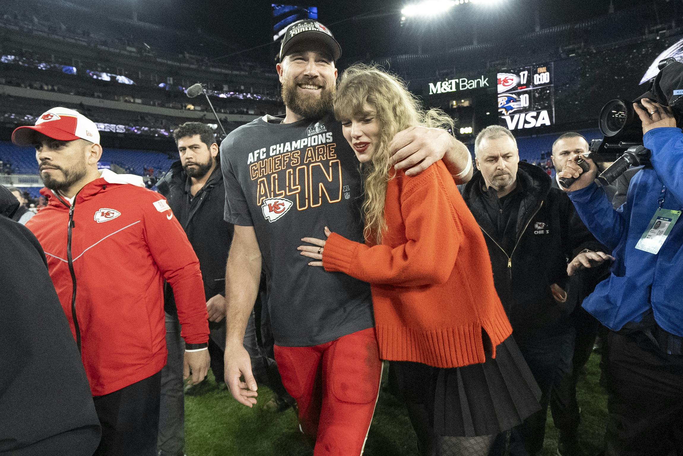 Kansas City Chiefs tight end Travis Kelce and Taylor Swift walk together after an AFC Championship NFL football game between the Kansas City Chiefs and the Baltimore Ravens, Sunday, Jan. 28, 2024, in Baltimore. The Kansas City Chiefs won 17-10. (AP Photo/Julio Cortez)