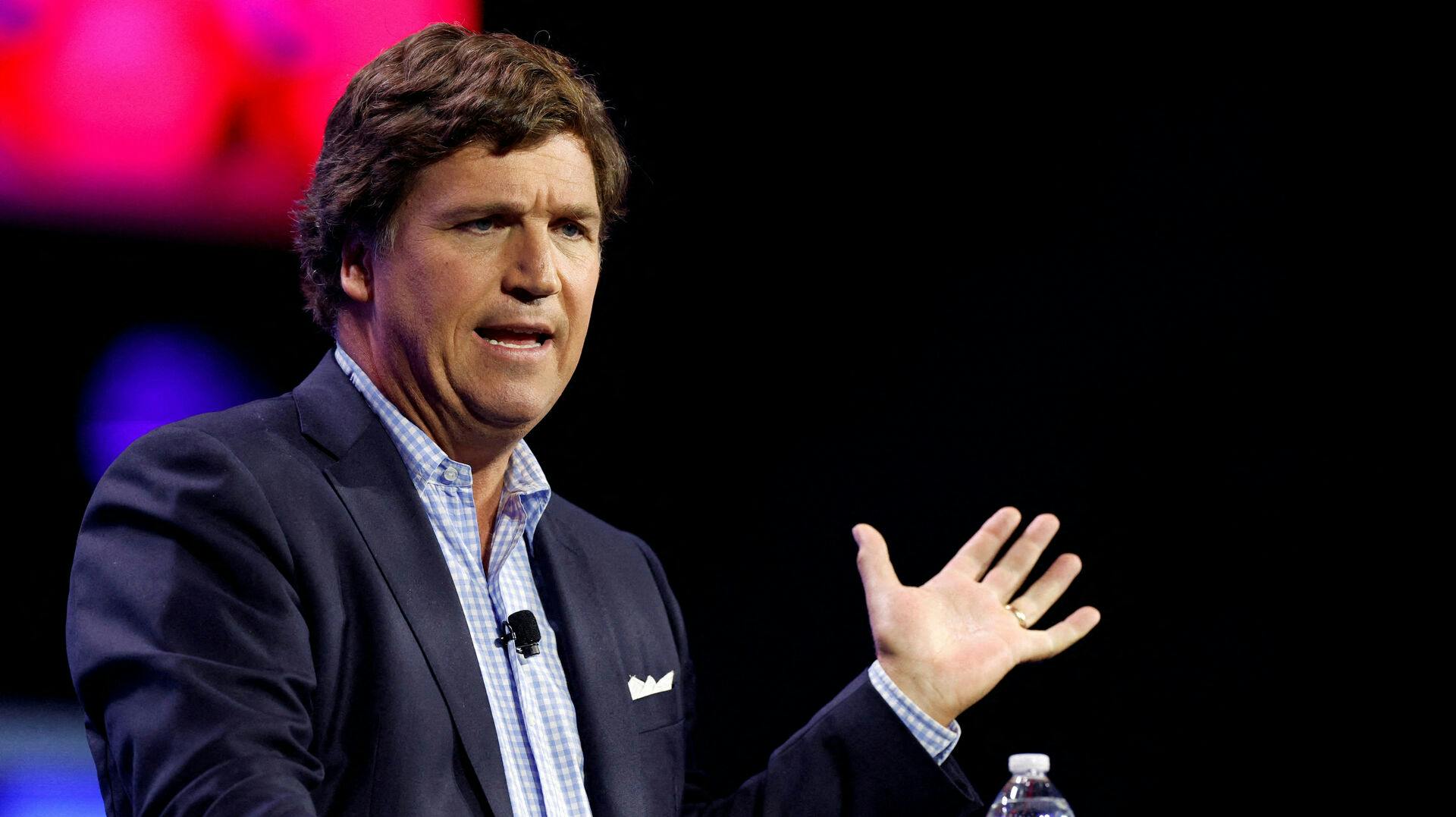 FILE PHOTO: Former Fox News commentator Tucker Carlson speaks during the Turning Point Action Conference in West Palm Beach, Florida, U.S. July 15, 2023. REUTERS/Marco Bello/File Photo