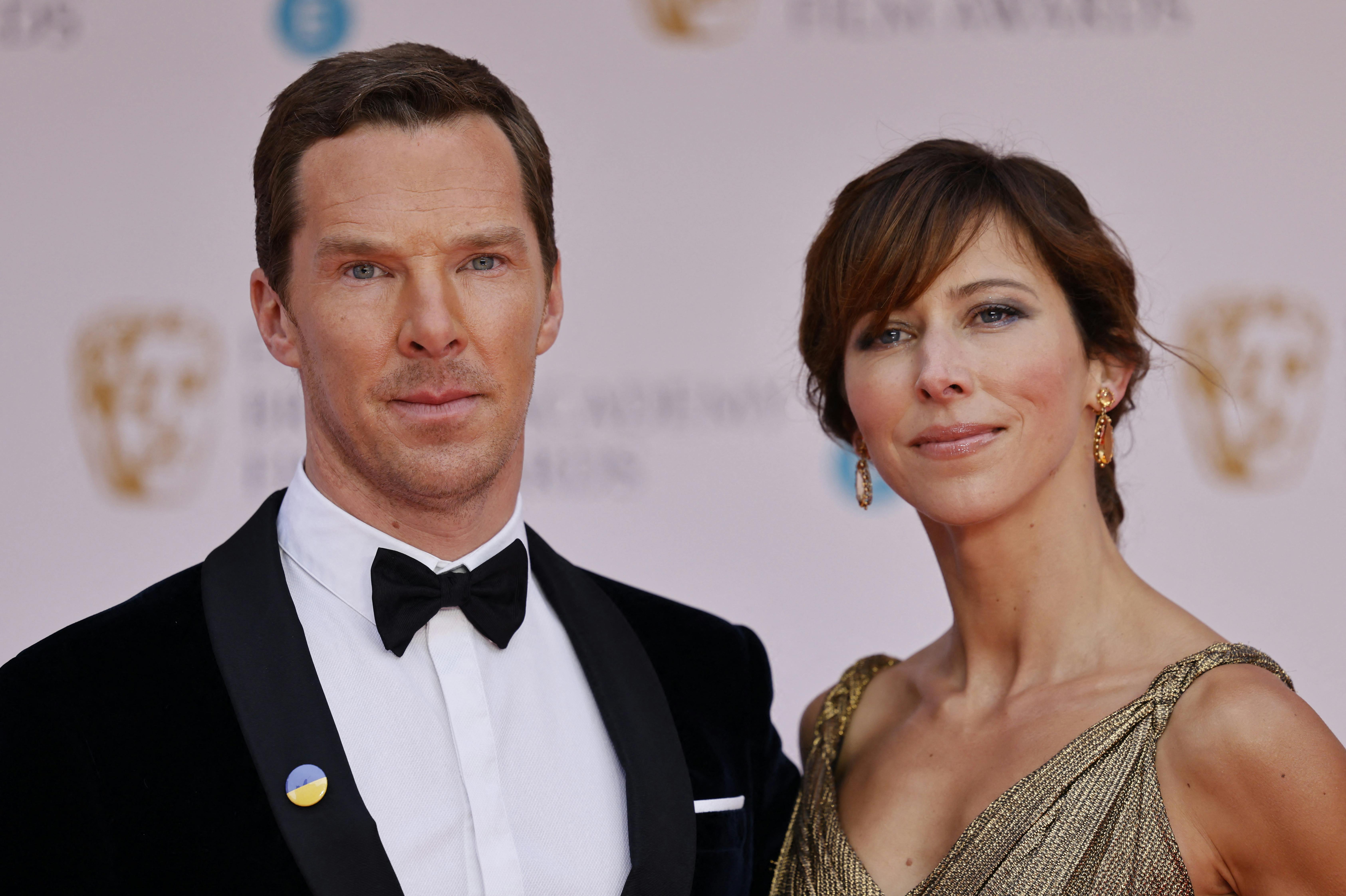 British actor Benedict Cumberbatch and his wife Sophie Hunter pose on the red carpet upon arrival at the BAFTA British Academy Film Awards at the Royal Albert Hall, in London, on March 13, 2022. Tolga Akmen / AFP