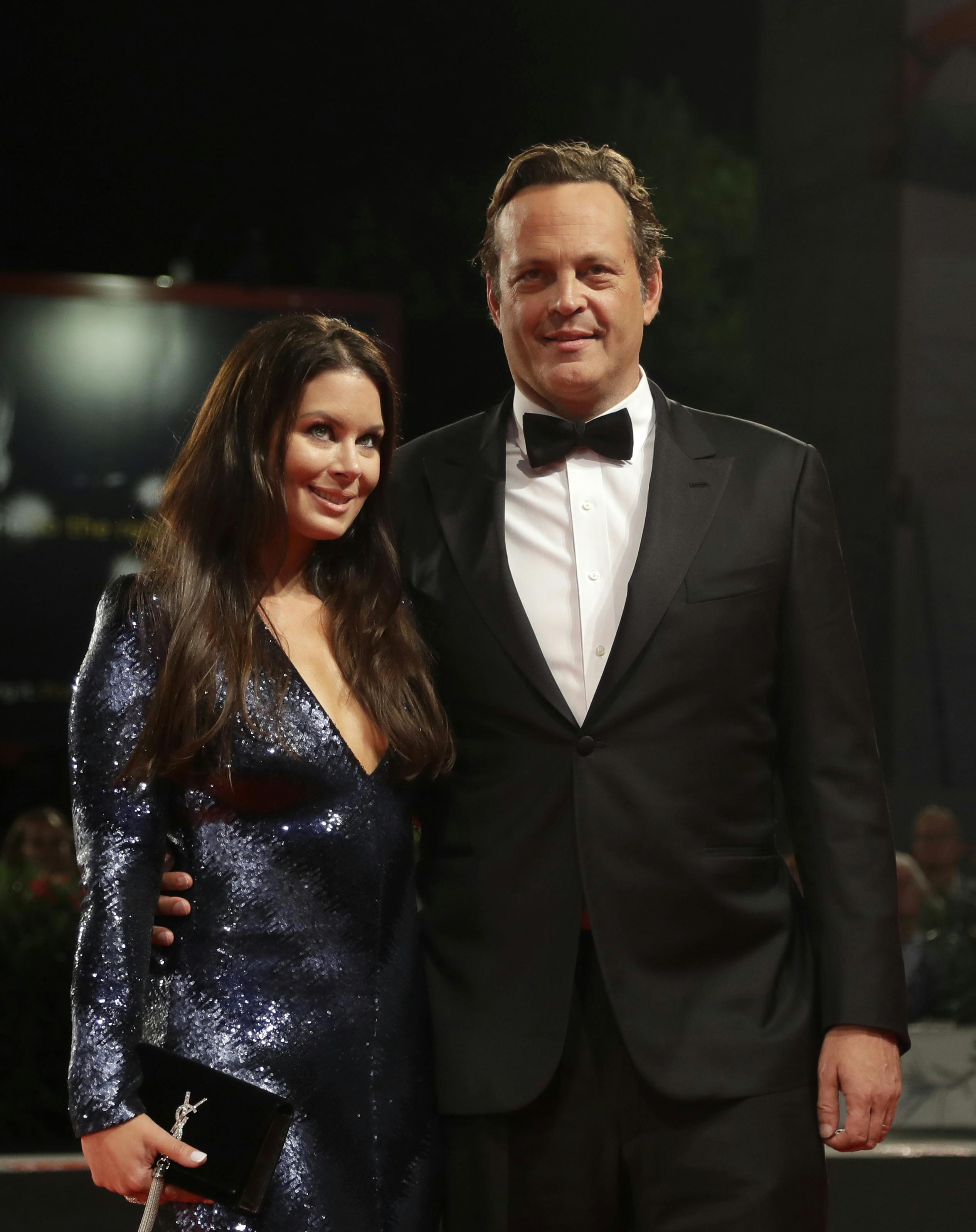 Actor Vince Vaughn and Kyla Weber pose for photographers upon arrival at the premiere of the film 'Dragged Across Concrete' at the 75th edition of the Venice Film Festival in Venice, Italy, Monday, Sept. 3, 2018. (AP Photo/Kirsty Wigglesworth)