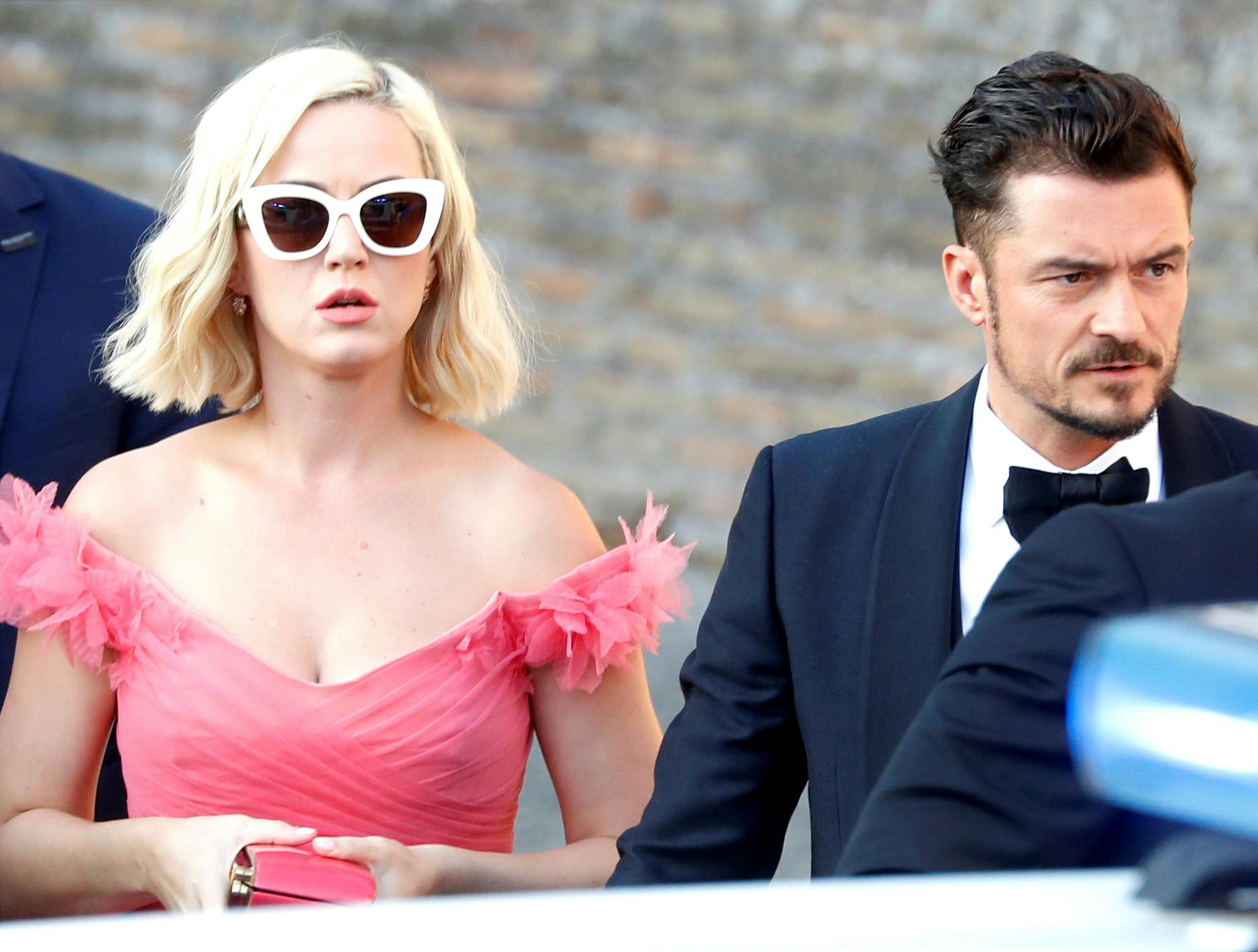 Singer Katy Perry and actor Orlando Bloom arrive to attend the wedding of fashion designer Misha Nonoo at Villa Aurelia in Rome, Italy, September 20, 2019. REUTERS/Yara Nardi