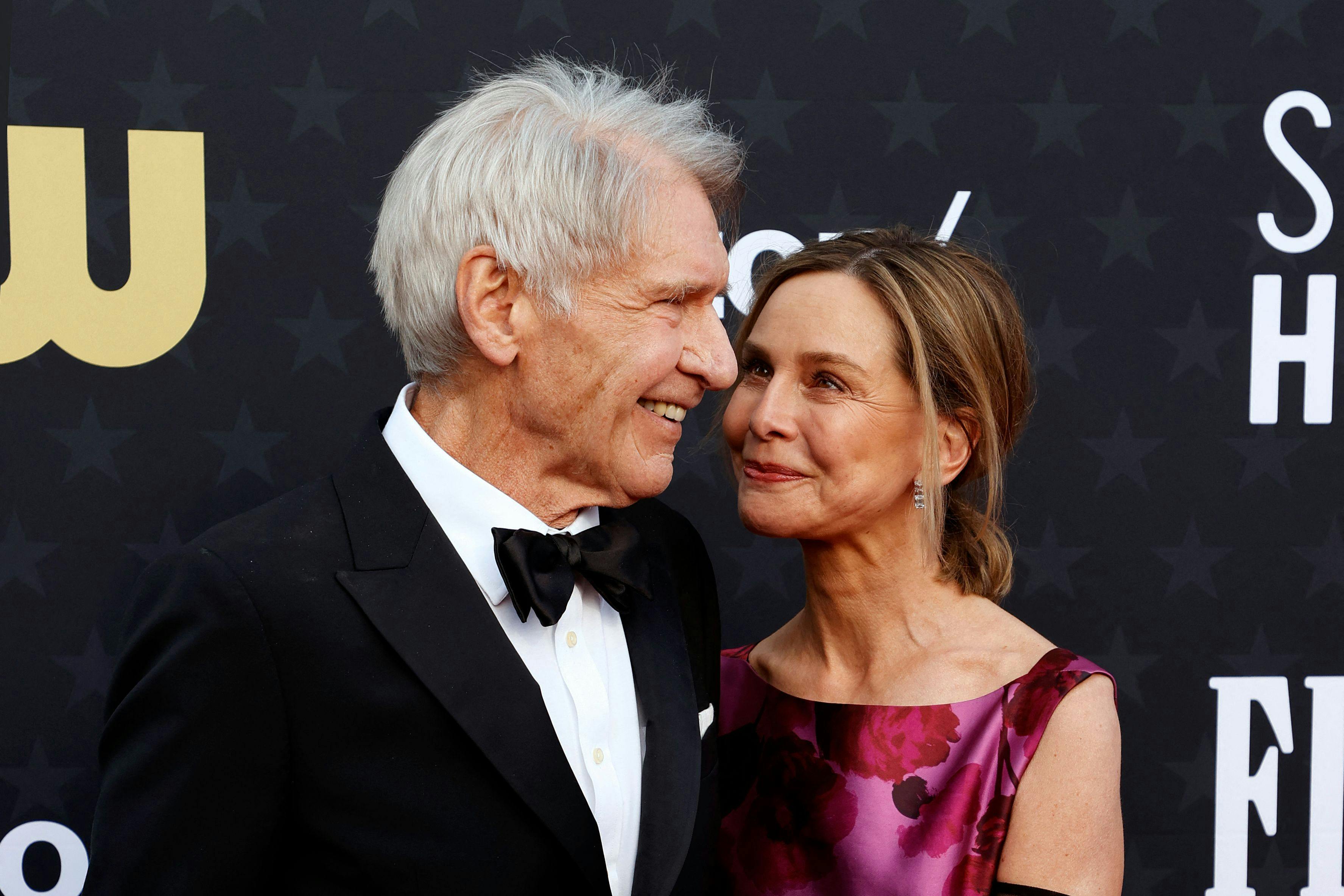TOPSHOT - US actor and honoreee Harrison Ford (L) and spouse US actress Calista Flockhart arrive for the 29th Annual Critics Choice Awards at the Barker Hangar in Santa Monica, California on January 14, 2024. (Photo by Michael TRAN / AFP)