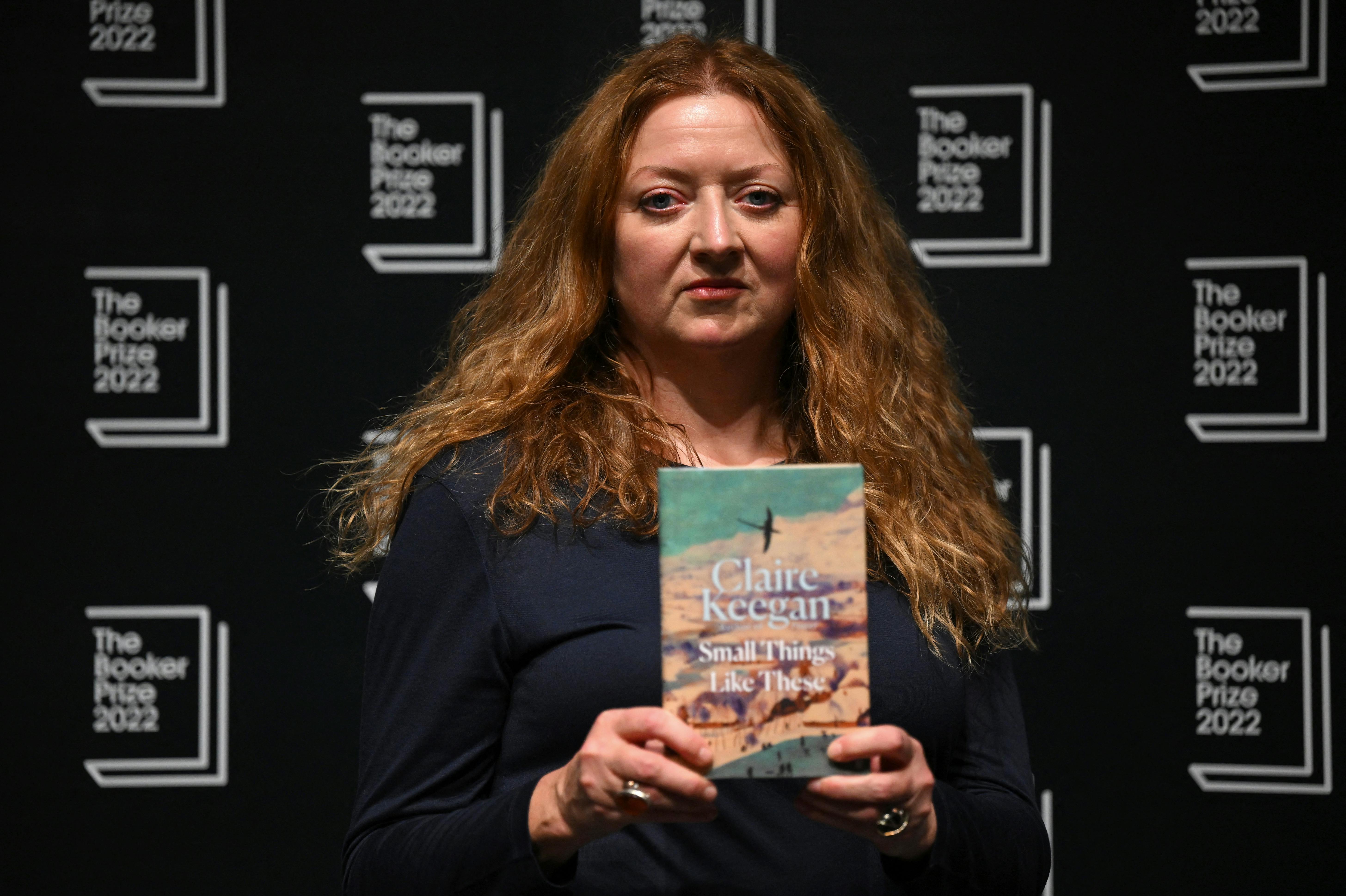 Irish author Claire Keegan holds her book 'Small Things Like These' during a photocall at the Shaw Theatre in King's Cross in London on October 14, 2022, ahead of Monday's announcement of the winner of the 2022 Booker Prize for Fiction. Daniel LEAL / AFP