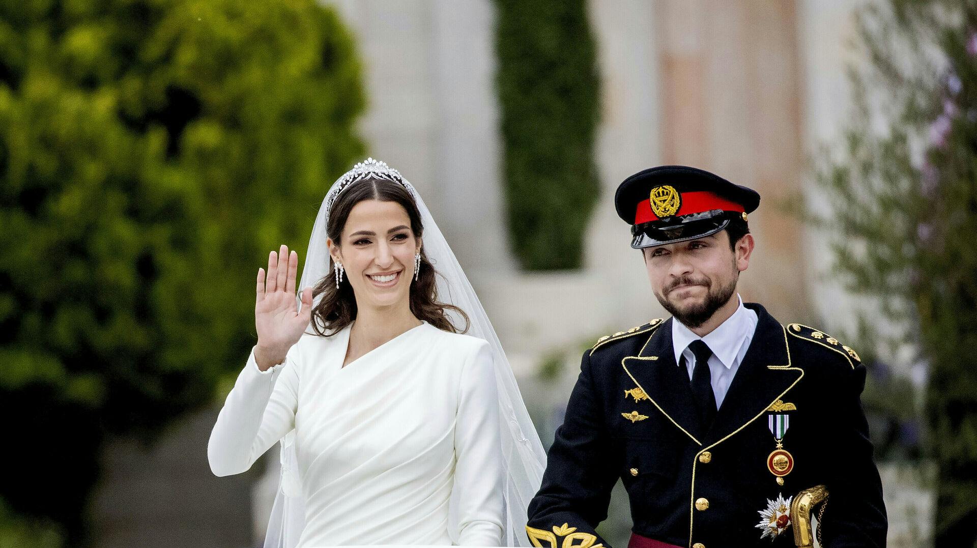 Crown Prince Al Hussein bin Abdullah II of Jordan and Miss Rajwa Alseif leave at the Zahran Palace in Amman, on June 01, 2023, after their Islamic marriage ceremony known as a katb ktab Photo by: Albert Nieboer/picture-alliance/dpa/AP Images