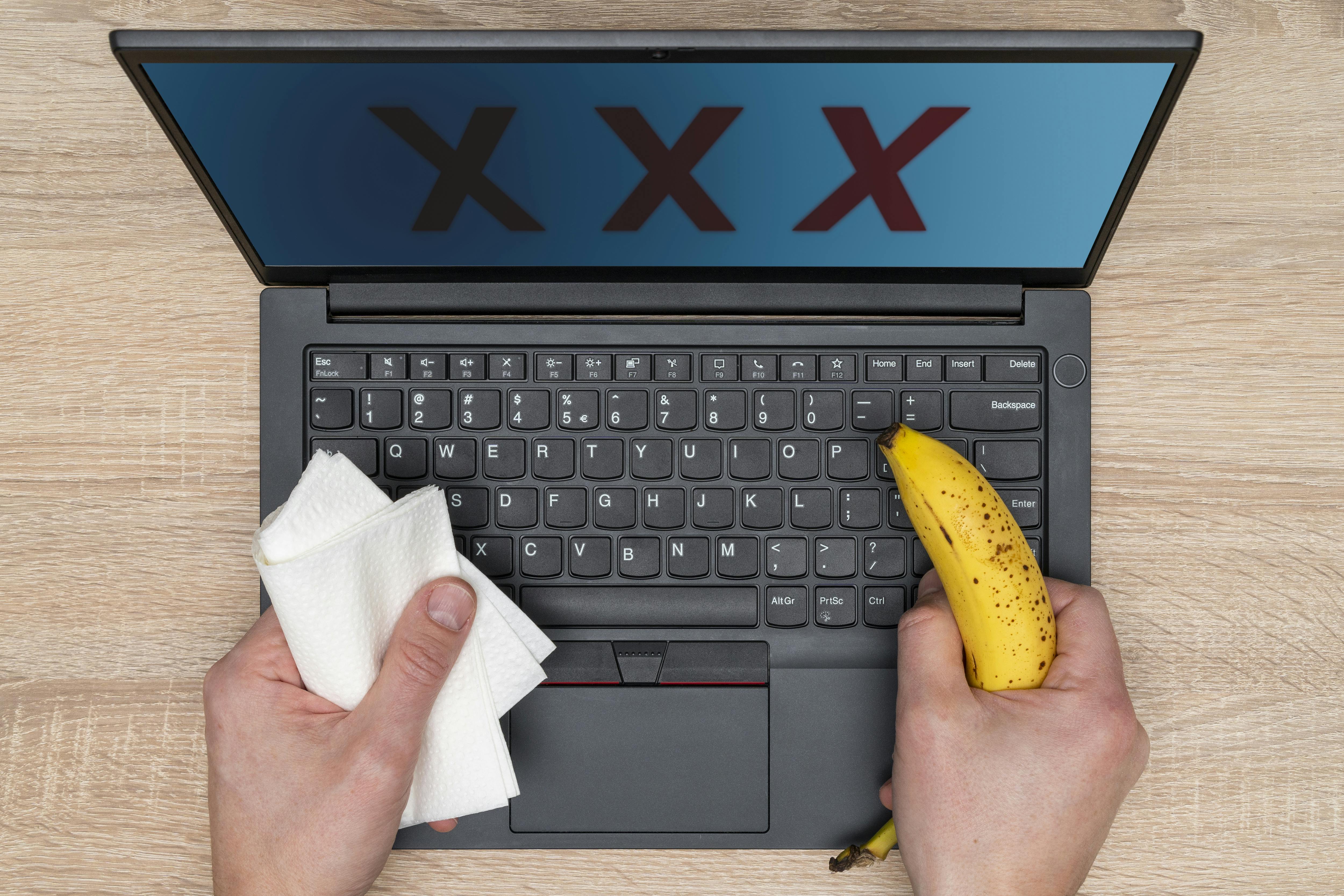 XXX written on laptop monitor.Online pornography, porn addicted. Internet porn concept. 