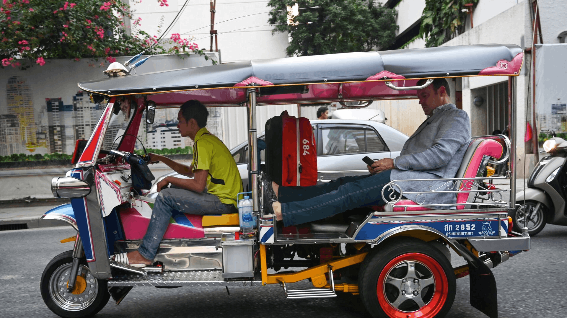 In this photo taken on April 26, 2019, a traveller rides in a tuktuk in Bangkok. Romeo GACAD / AFP