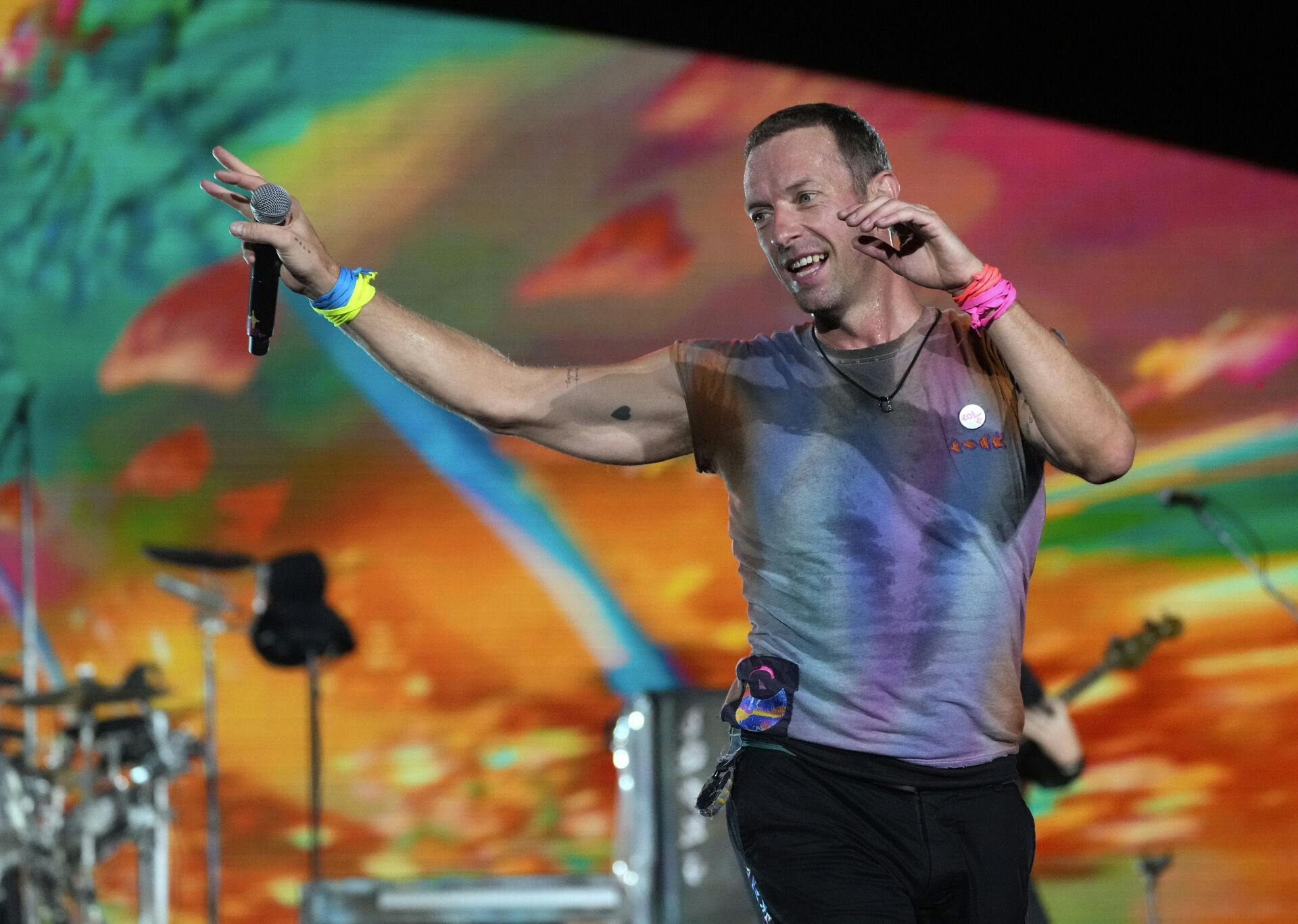 Chris Martin of Coldplay performs at the Rose Bowl, Saturday, Sept. 30, 2023, in Pasadena, Calif. (AP Photo/Chris Pizzello)