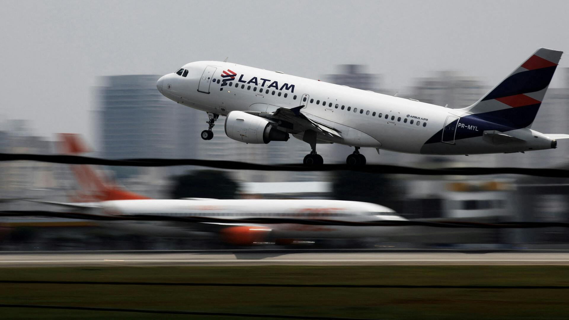 FILE PHOTO: A LATAM Airlines Brasil Airbus A319-100 plane takes off from Congonhas airport in Sao Paulo, Brazil December 19, 2017. REUTERS/Nacho Doce/File Photo