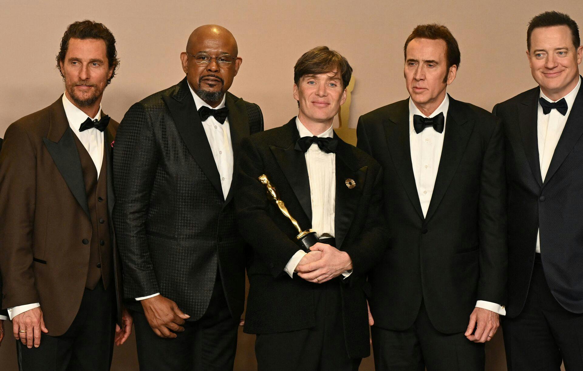 TOPSHOT - Actors Matthew McConaughey, Forest Whitaker, Nicolas Cage and Brendan Fraser pose Irish actor Cillian Murphy winner of the Oscar for Best Actor in a Leading Role for "Oppenheimer" during the 96th Annual Academy Awards at the Dolby Theatre in Hollywood, California on March 10, 2024. (Photo by Robyn BECK / AFP)