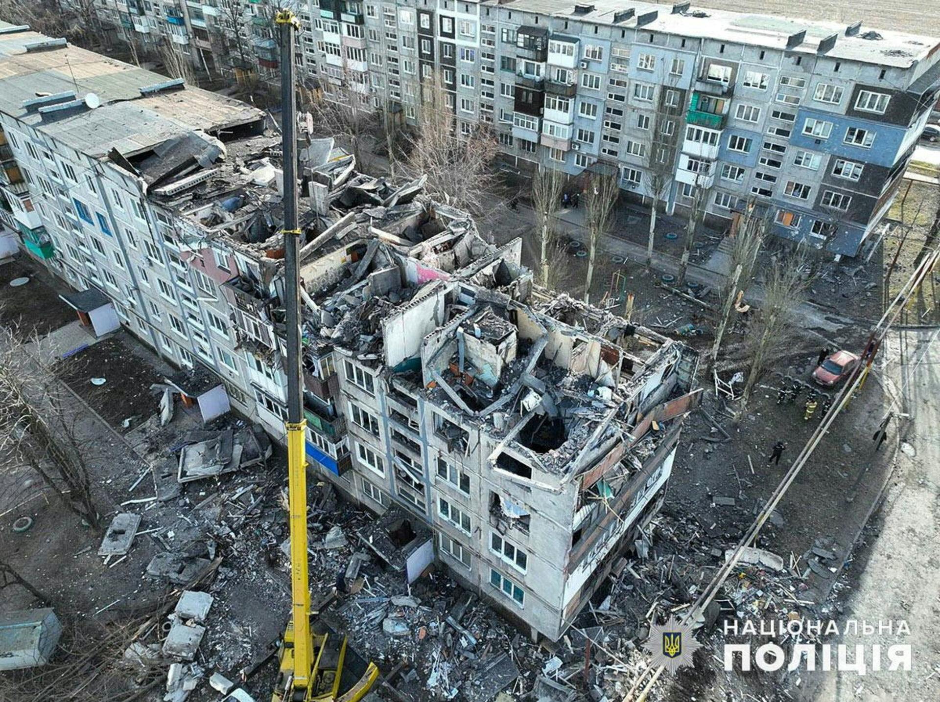 A drone view shows an apartment building 