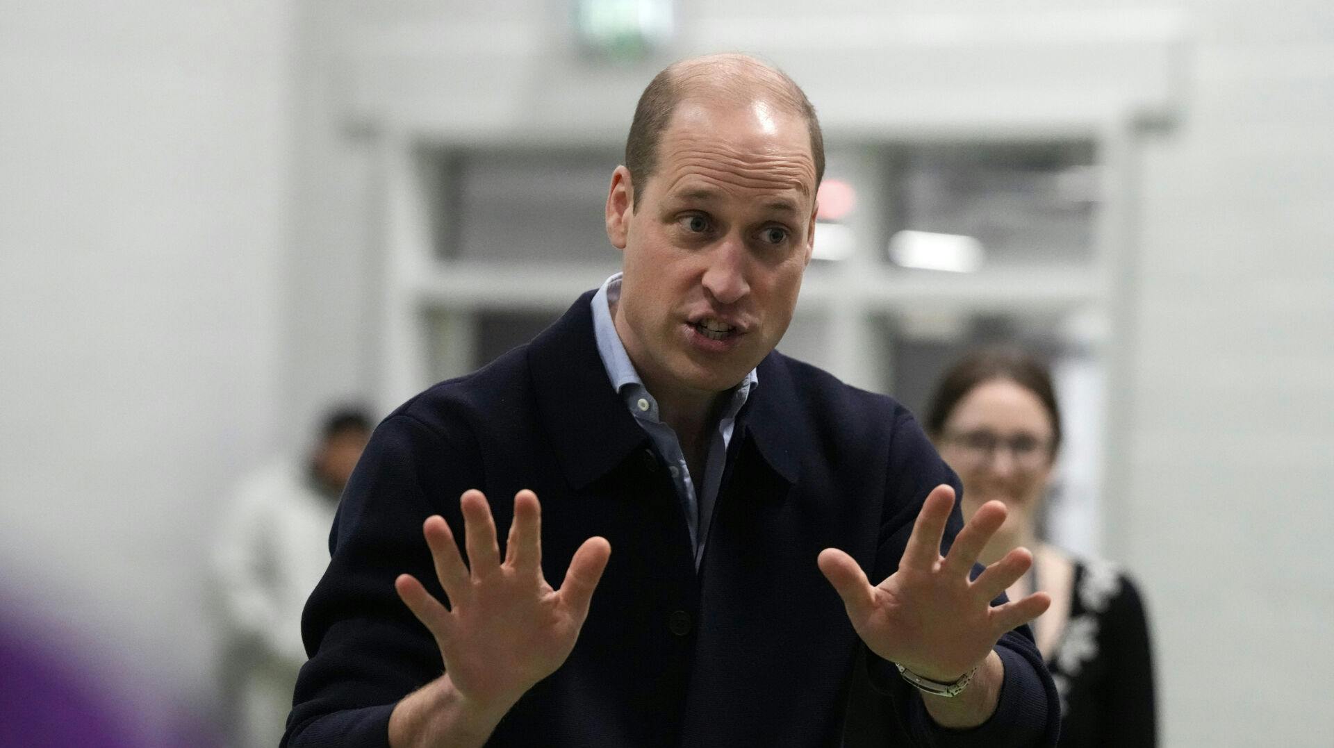 Prince William gestures