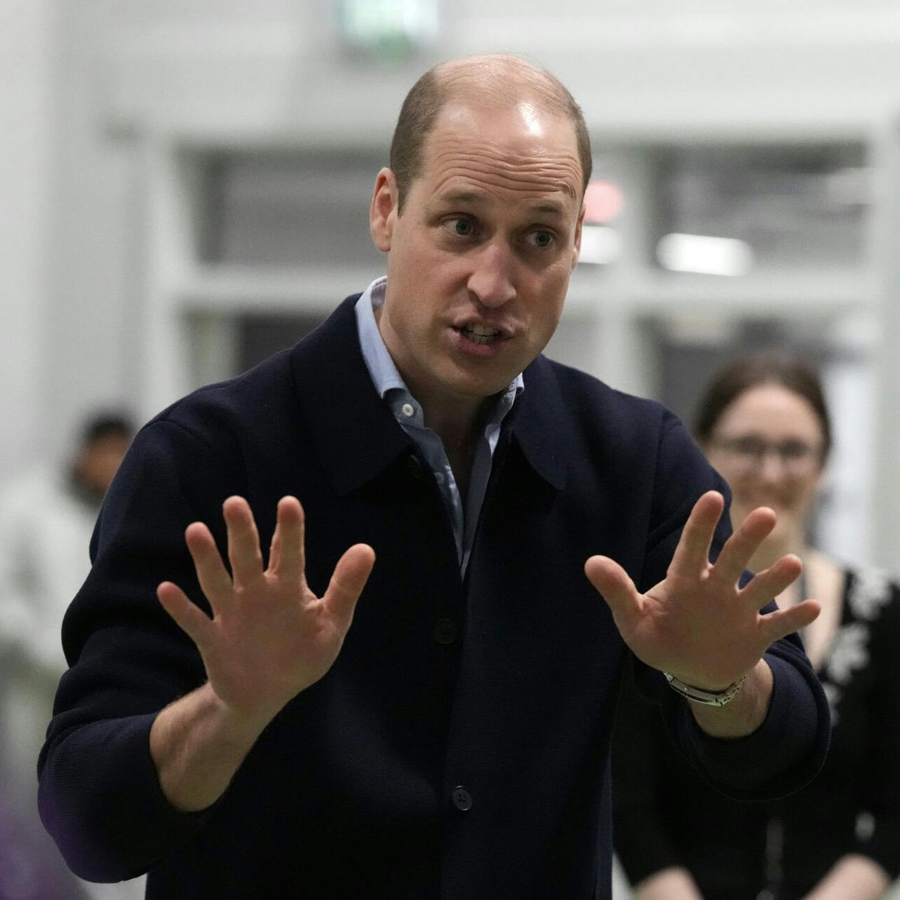 Prince William gestures during his visit to WEST, the new OnSide Youth Zone in Hammersmith and Fulham in London, Thursday, March 14, 2024. Named WEST (standing for 'Where Everyone Sticks Together') by local young people, the new Youth Zone will be staffed by skilled and dedicated youth workers who will support young people from across west London to develop the skills and confidence they need to achieve their dreams. (AP Photo/Frank Augstein, Pool)