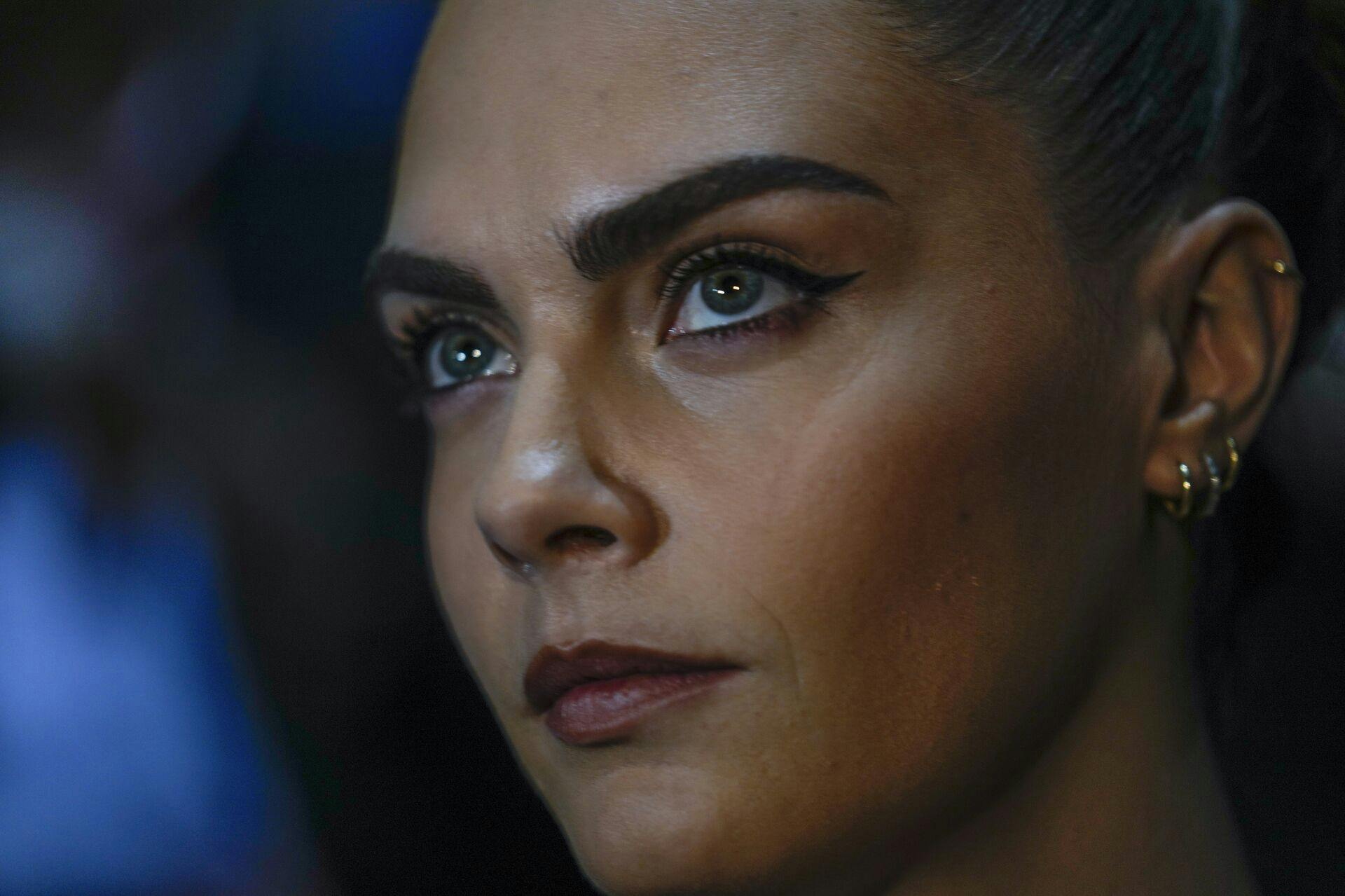Cara Delevingne attends the Emporio Armani women's Spring Summer 2024 collection presented in Milan, Italy, Thursday, Sept. 21, 2023. (AP Photo/Luca Bruno)