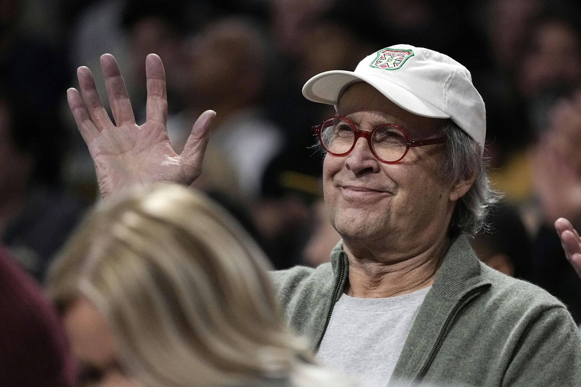 Actor Chevy Chase watches during the first half of an NBA basketball game between the Los Angeles Lakers and the Phoenix Suns Wednesday, March 22, 2023, in Los Angeles. (AP Photo/Mark J. Terrill)