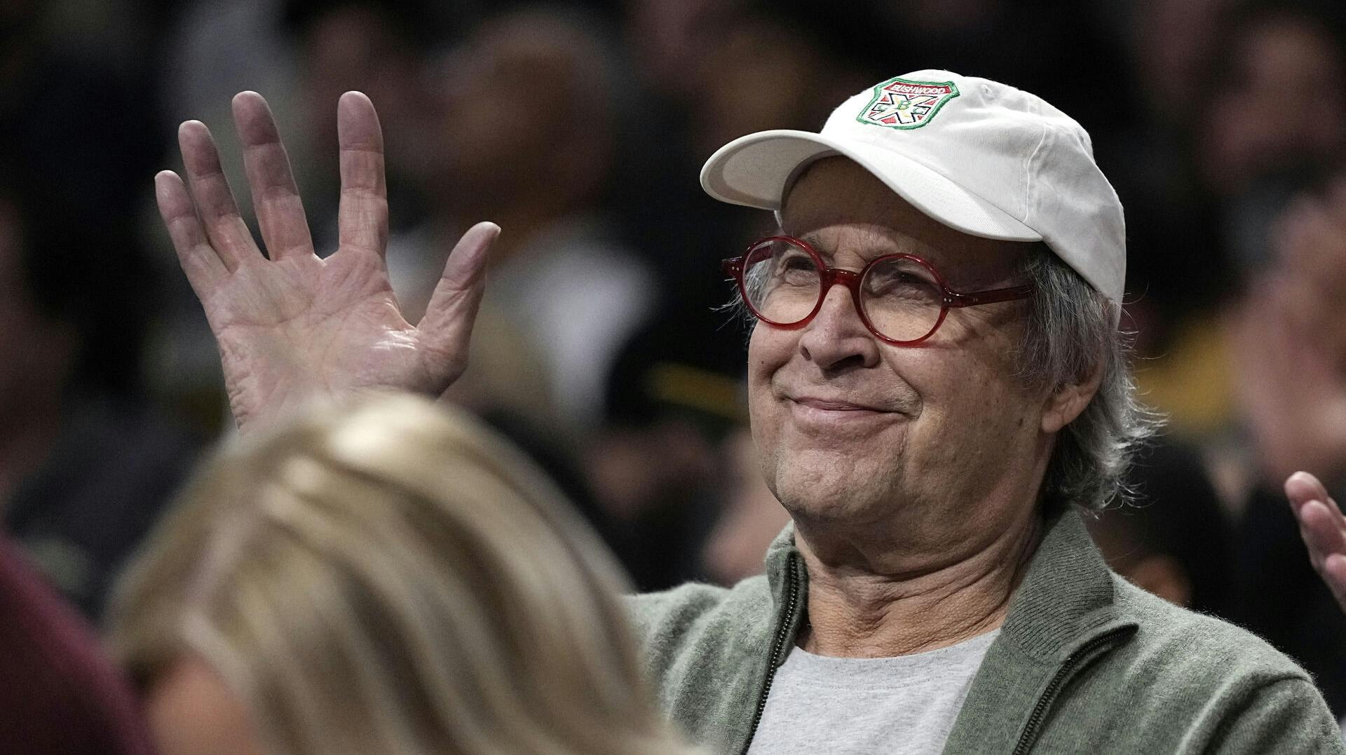 Actor Chevy Chase watches during the first half of an NBA basketball game between the Los Angeles Lakers and the Phoenix Suns Wednesday, March 22, 2023, in Los Angeles. (AP Photo/Mark J. Terrill)