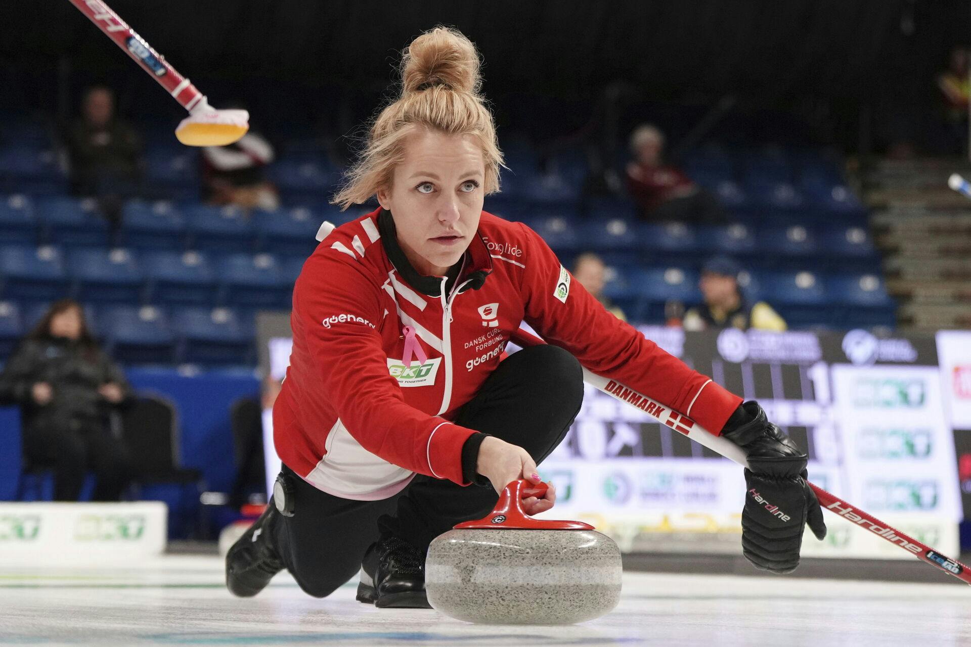 Denmark's skip Madeleine Dupont delivers a stone during a match against Scotland at the women's Curling World Championships in Sydney, Nova Scotia Monday, March 18, 2024. (Darren Calabrese/The Canadian Press via AP)