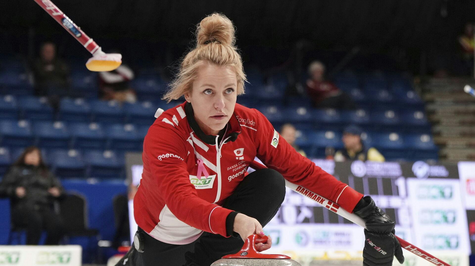 Denmark's skip Madeleine Dupont delivers a stone during a match against Scotland at the women's Curling World Championships in Sydney, Nova Scotia Monday, March 18, 2024. (Darren Calabrese/The Canadian Press via AP)