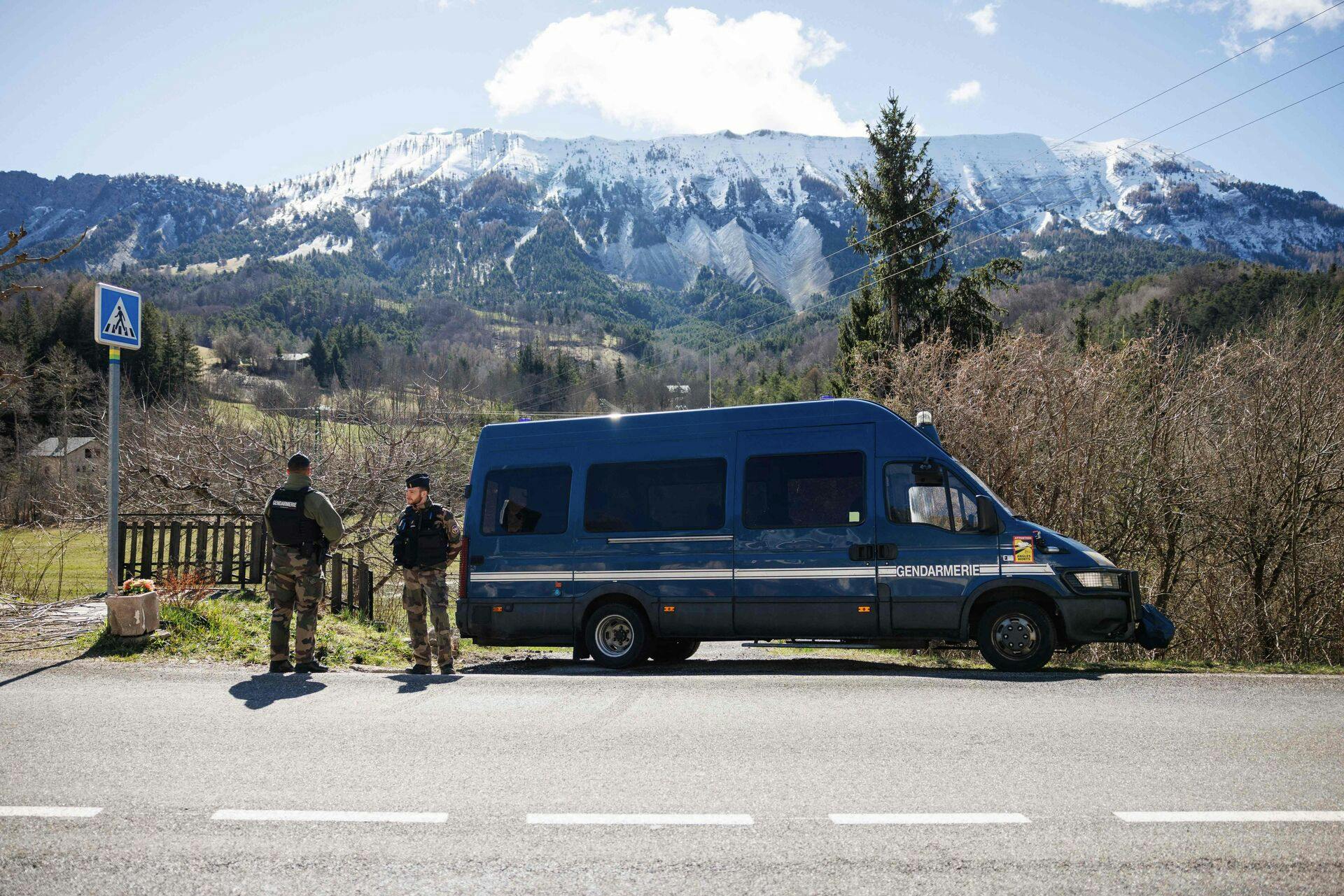 French Gendarmes secure a perimeter around the French southern Alps tiny village of Le Haut-Vernet, in Le Vernet on April 2, 2024, two days after French investigators have found the "bones" of a toddler who went missing last summer. The discovery is the first major breakthrough in the case of two-and-a-half-year-old Emile, who vanished on July 8 last year while staying with his grandparents. (Photo by CLEMENT MAHOUDEAU / AFP)