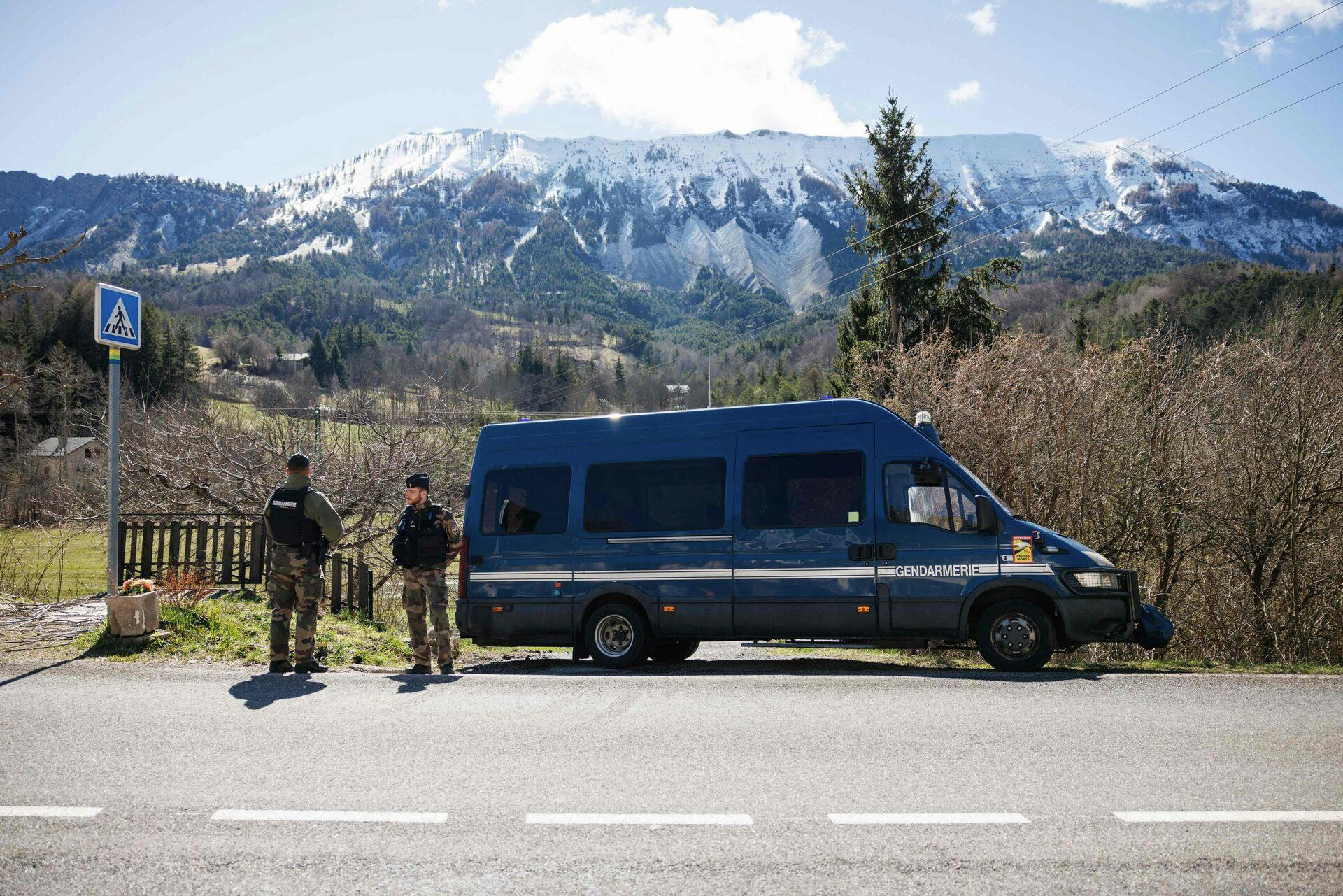 French Gendarmes secure a perimeter around the French southern Alps tiny village of Le Haut-Vernet, in Le Vernet on April 2, 2024, two days after French investigators have found the "bones" of a toddler who went missing last summer. The discovery is the first major breakthrough in the case of two-and-a-half-year-old Emile, who vanished on July 8 last year while staying with his grandparents. (Photo by CLEMENT MAHOUDEAU / AFP)