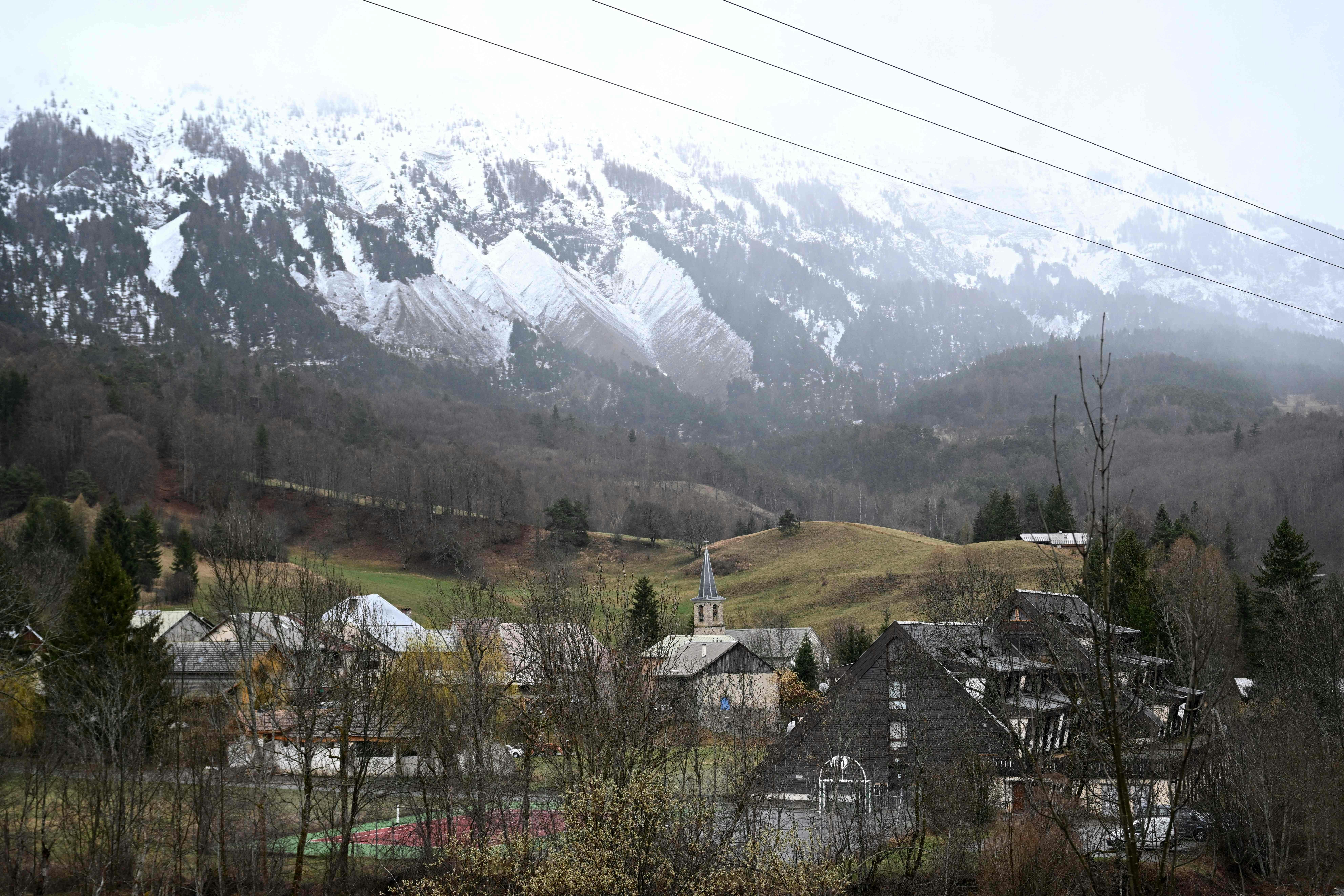 This photograph shows a general view of the Alpine village of Le Vernet on March 31, 2024, after French investigators have found near the village the "bones" of a toddler who went missing last summert. The discovery is the first major breakthrough in the case of two-and-a-half-year-old Emile, who vanished on July 8 last year while staying with his grandparents. (Photo by NICOLAS TUCAT / AFP)