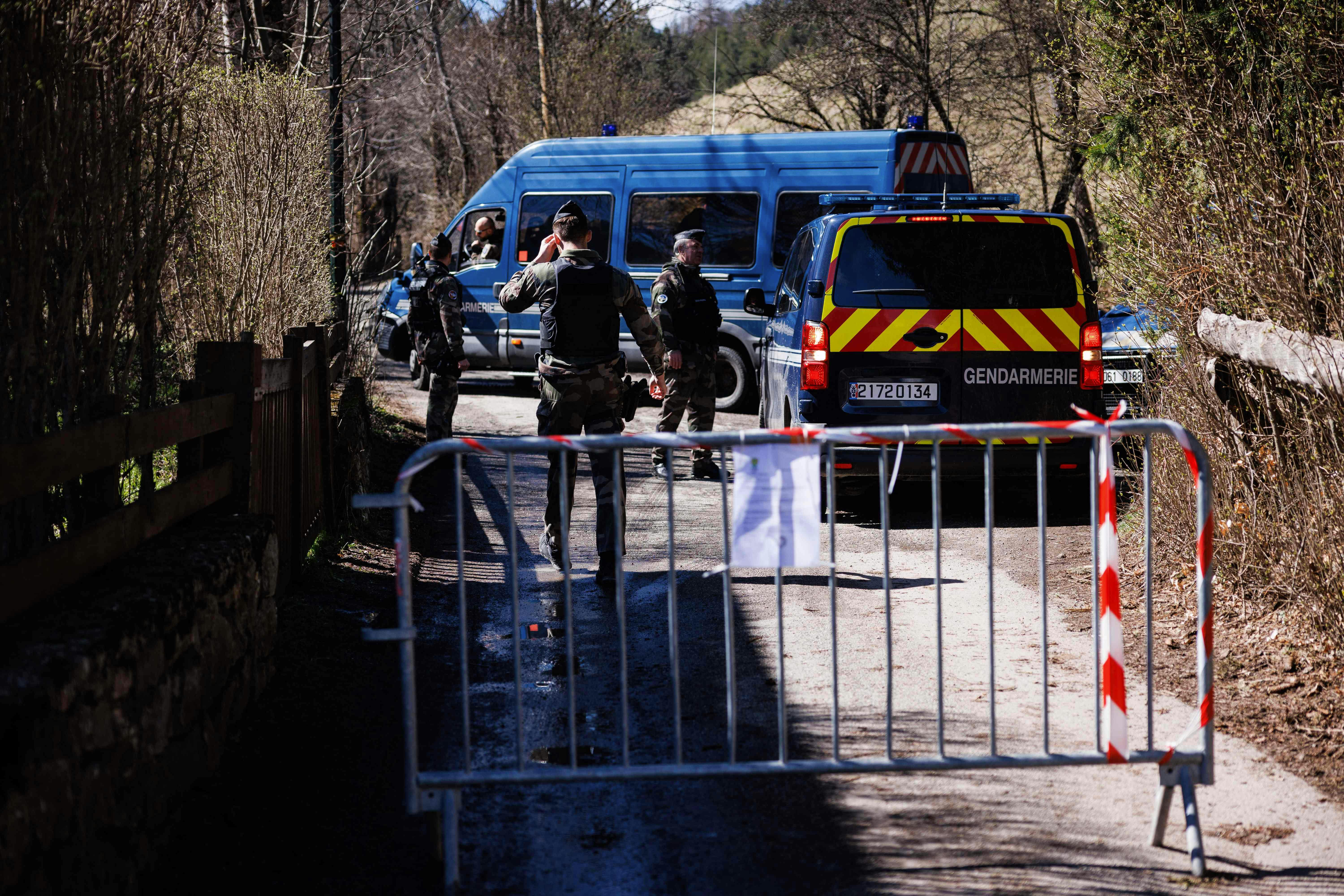 French Gendarmes secure a perimeter around the French southern Alps tiny village of Le Haut-Vernet, in Le Vernet on April 2, 2024, two days after French investigators have found the "bones" of a toddler who went missing last summer. The discovery is the first major breakthrough in the case of two-and-a-half-year-old Emile, who vanished on July 8 last year while staying with his grandparents. (Photo by CLEMENT MAHOUDEAU / AFP)