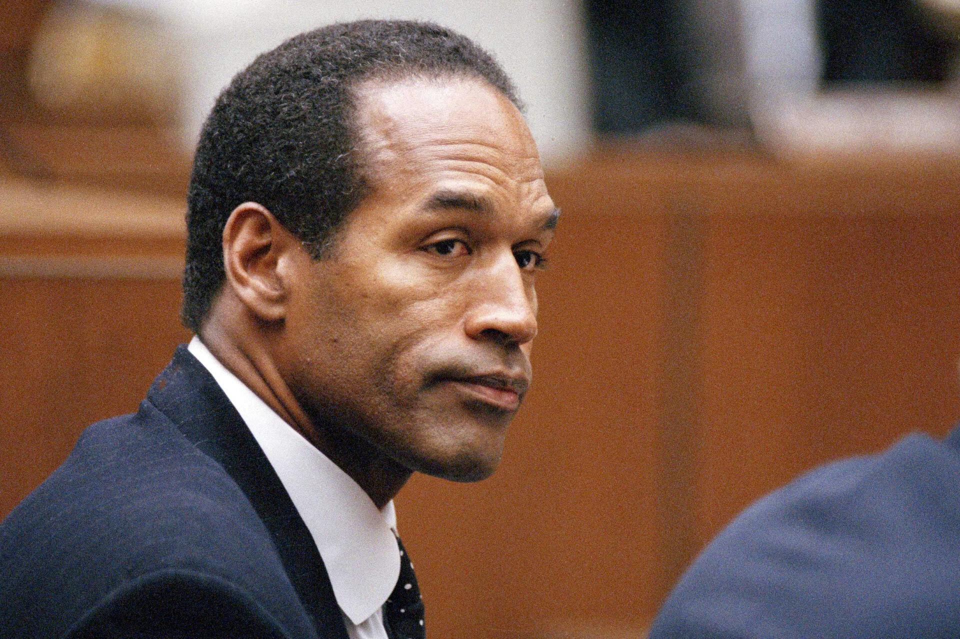FILE - O.J. Simpson sits at his arraignment in Superior Court 