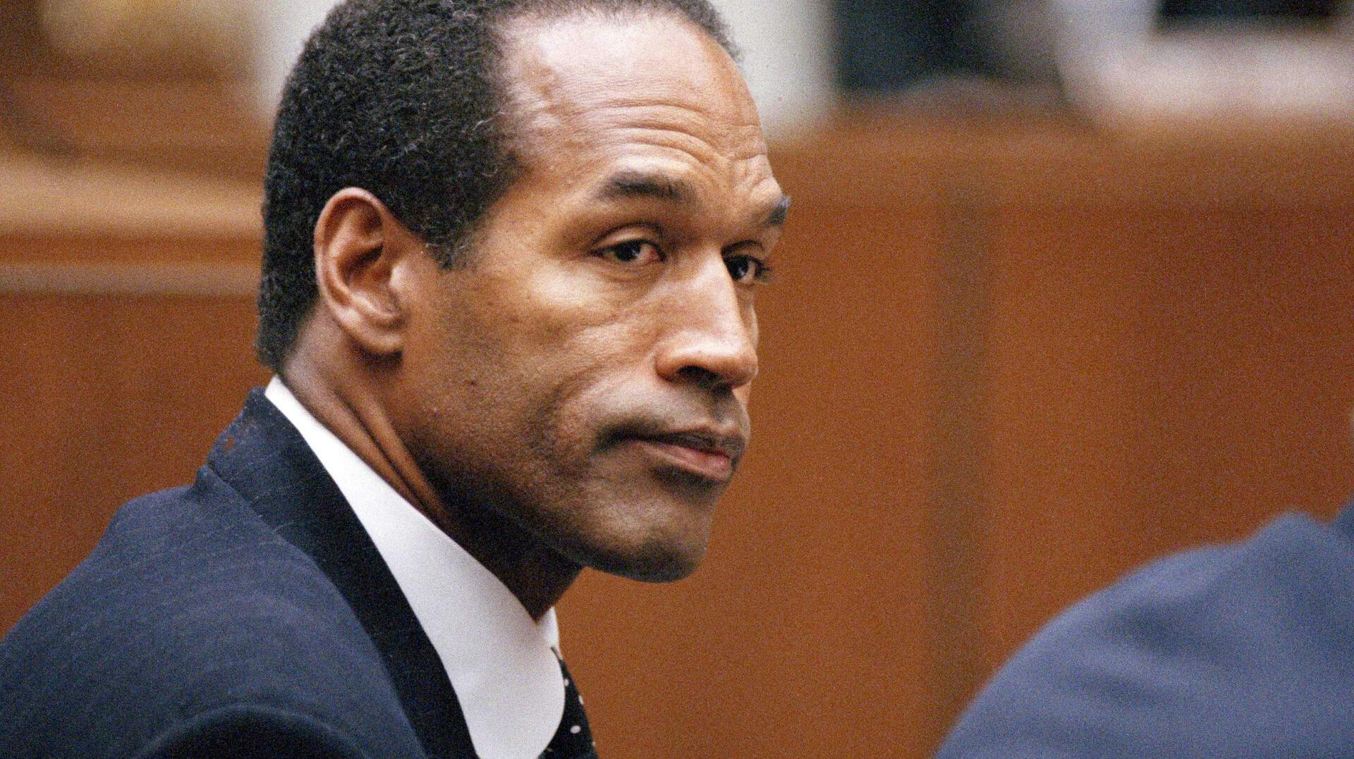FILE - O.J. Simpson sits at his arraignment in Superior Court