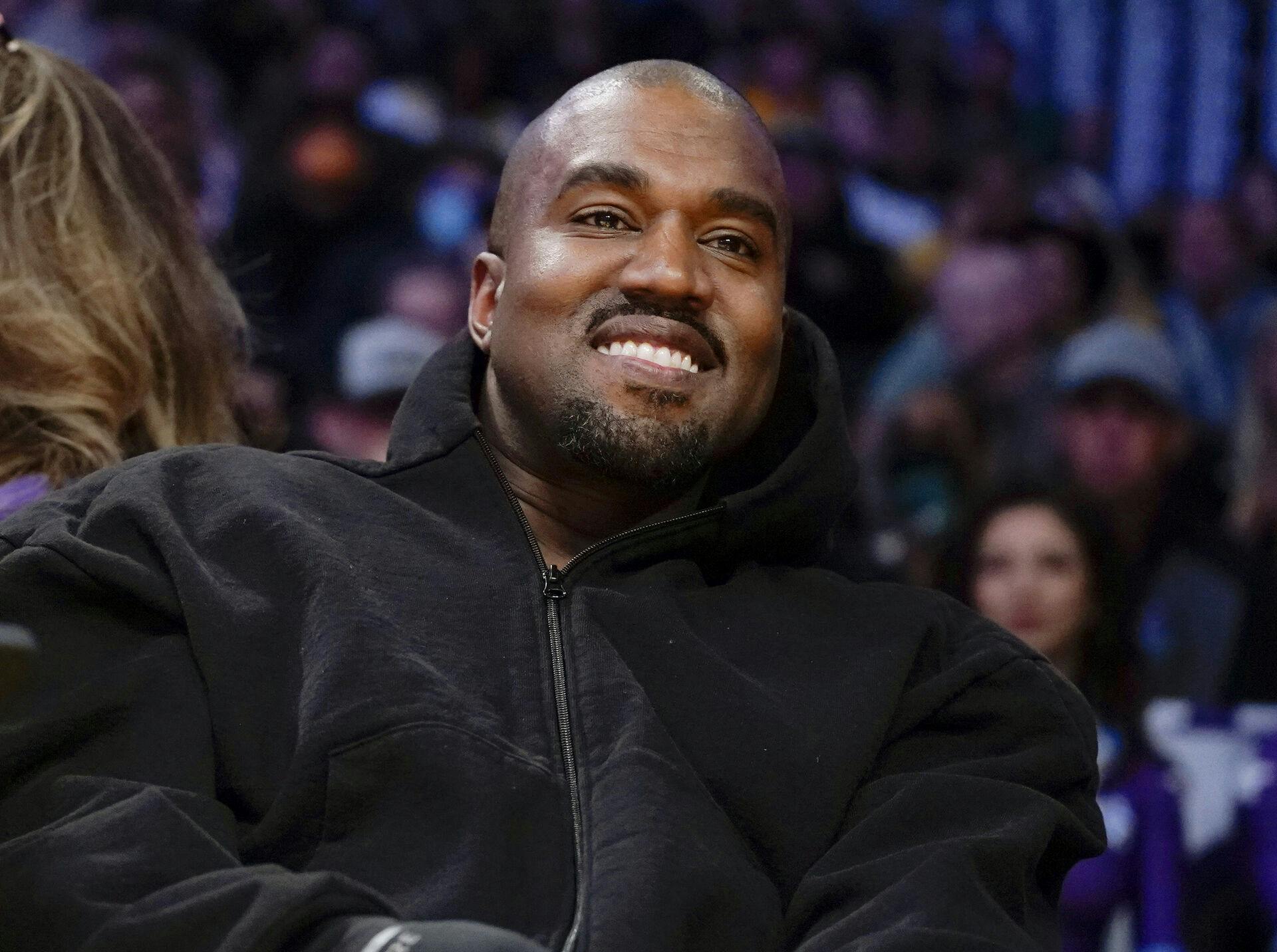 FILE - Kanye West, known as Ye, watches the first half o