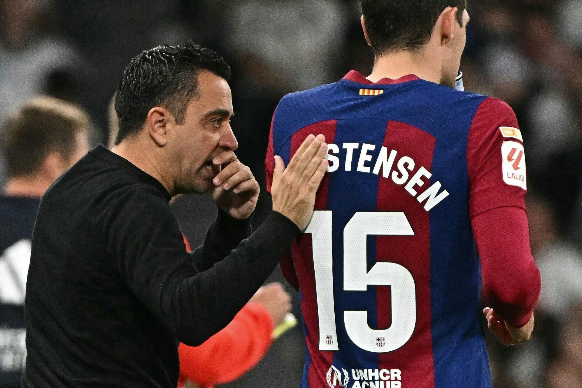 Xavi og Andreas Christensen.