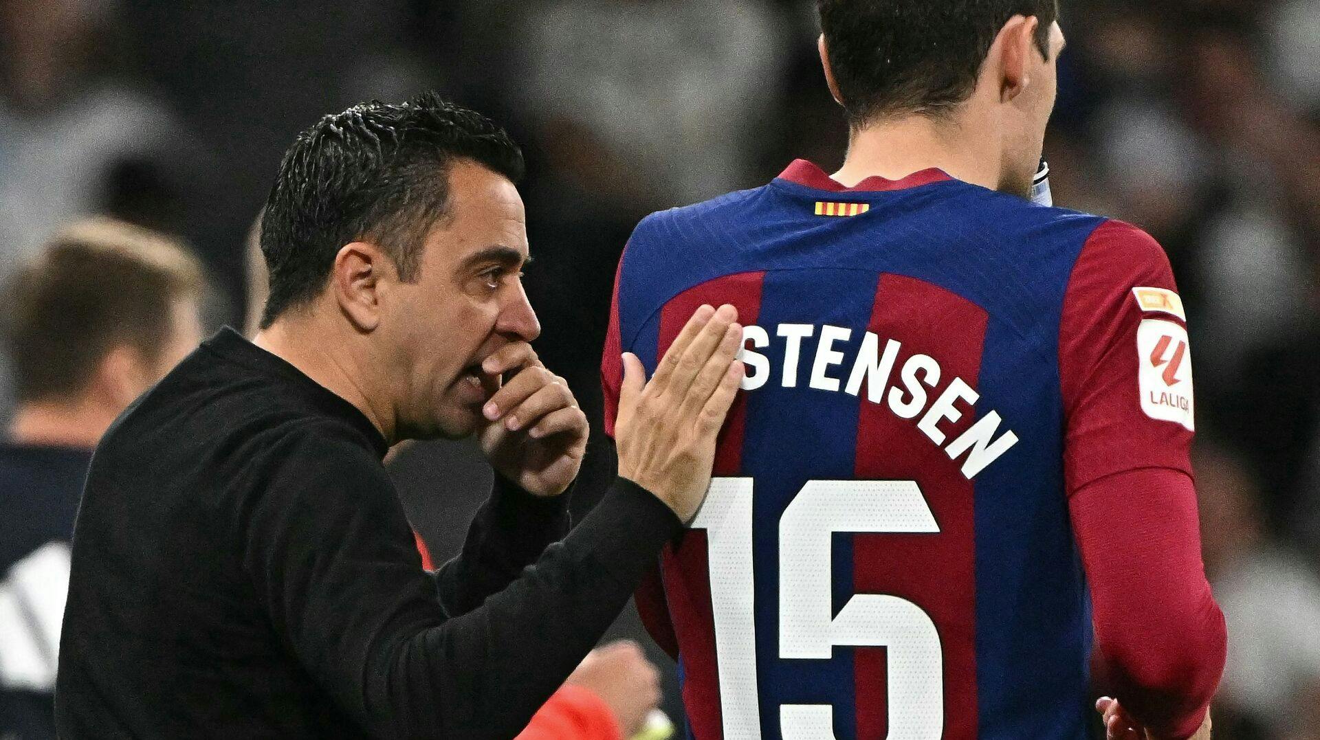 Xavi og Andreas Christensen.