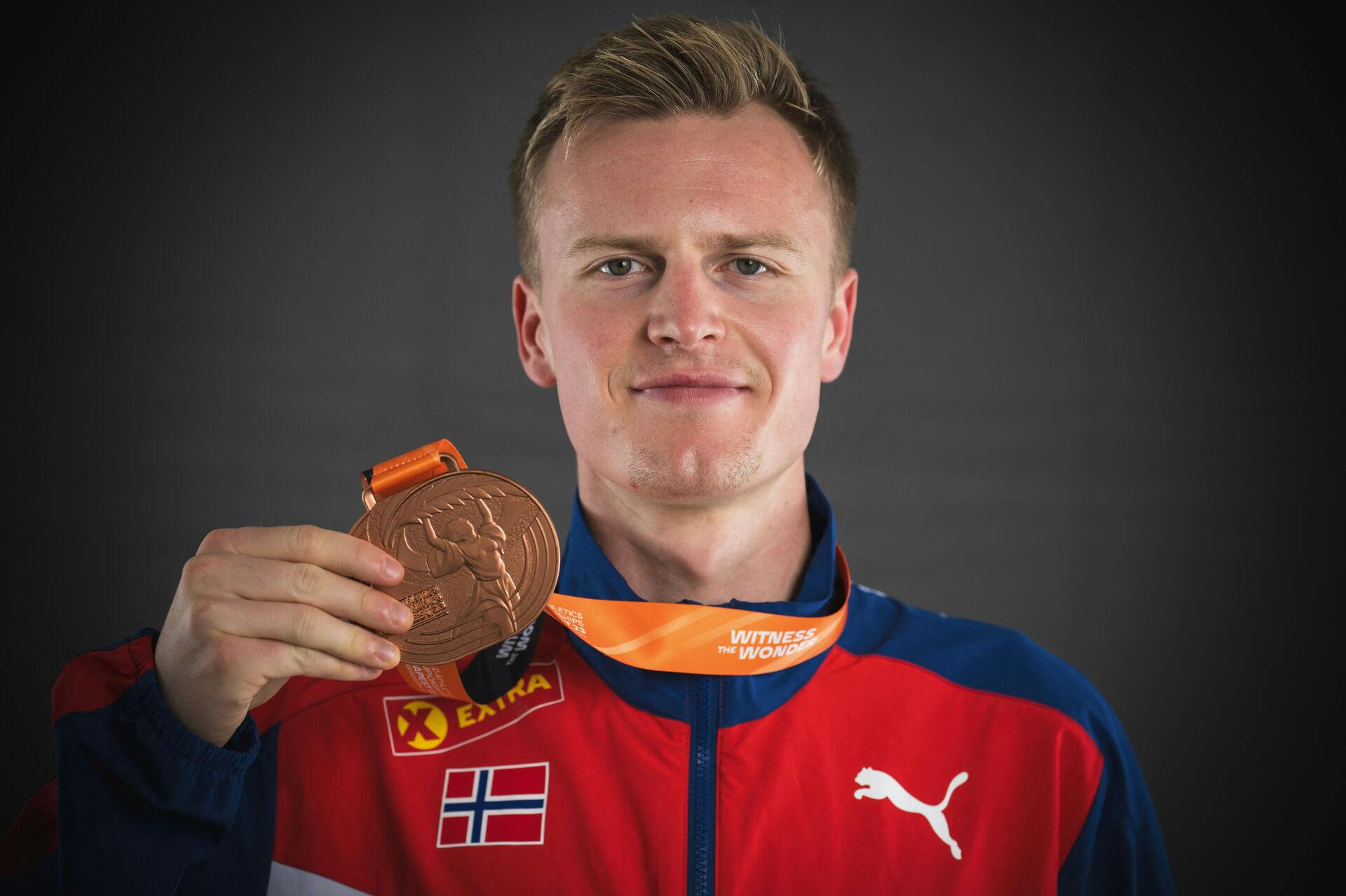 Men's 1500m bronze medallist Norway's Narve Gilje Nordas poses for portraits during a studio photo session on the sidelines of the World Athletics Championships at the National Athletics Centre in Budapest on August 25, 2023. ANDREJ ISAKOVIC / AFP