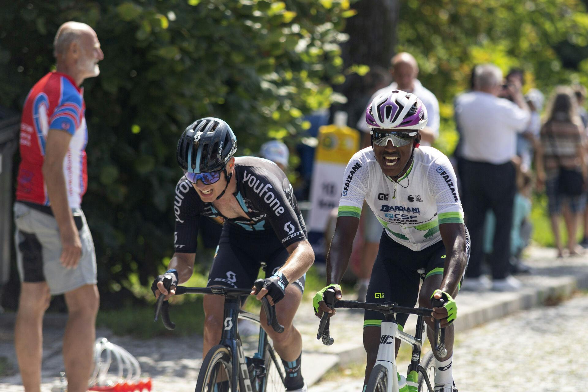 L-R Tobias Lund Andersen (Denmark) and Henok Mulubrhan (Eritrea) compete in the Sazka Tour cycling race, final 4th stage, on August 7, 2022, in Sternberk, Czech Republic. Photo/Stanislav Helona (CTK via AP Images)