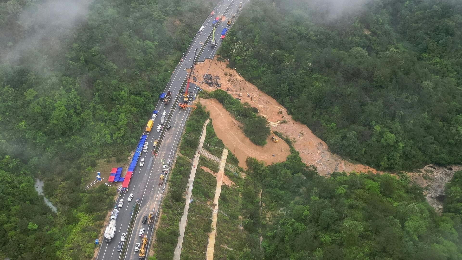 This photo taken on May 1, 2024 shows an aerial view of a collapsed section of a highway near Meizhou, in southern China's Guangdong province. At least 36 people died after part of a highway collapsed due to heavy rain on May 1, state media said. (Photo by CNS / CNS / AFP) / China OUT