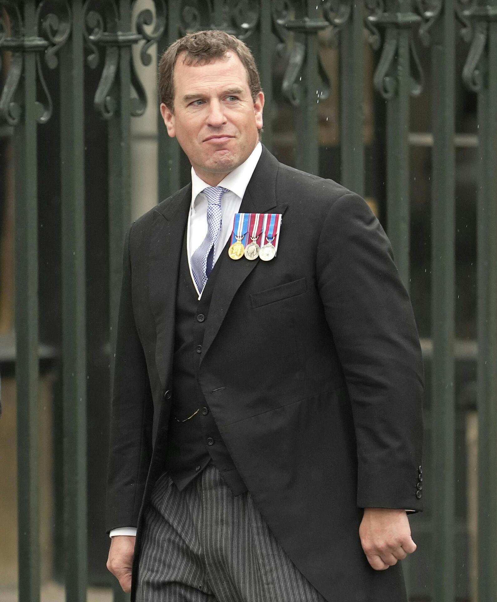 Peter Phillips arrives to attend Britain's King Charles III and Queen Consort Camilla's coronation ceremony, at Westminster Abbey, in London, Saturday, May 6, 2023. (AP Photo/Kin Cheung)